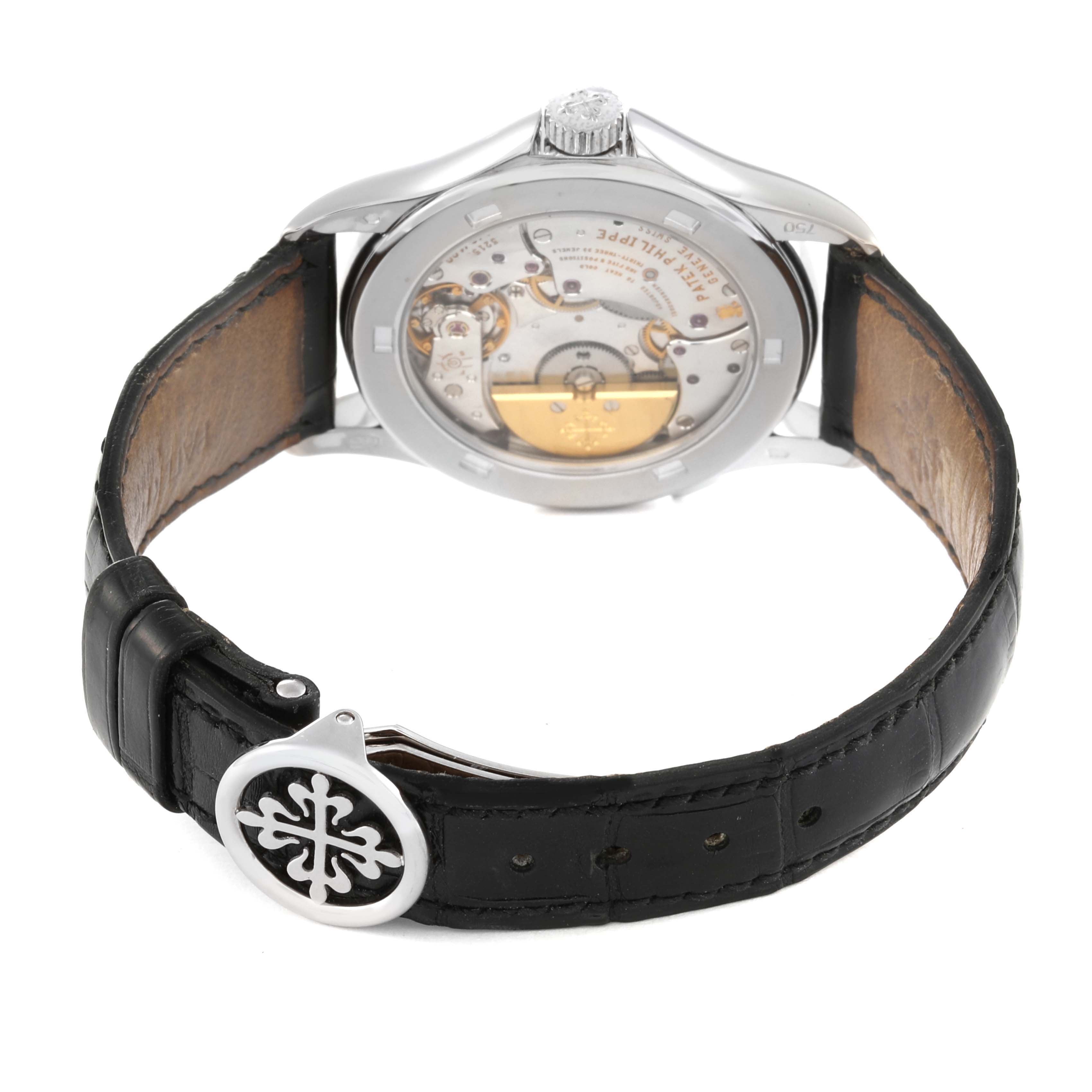The image shows a Patek Philippe Complications 5110G Men
s White Gold Silver Dial 5110G Men
s White Gold Silver Dial model watch from the rear, highlighting the movement and leather strap with clasp.
