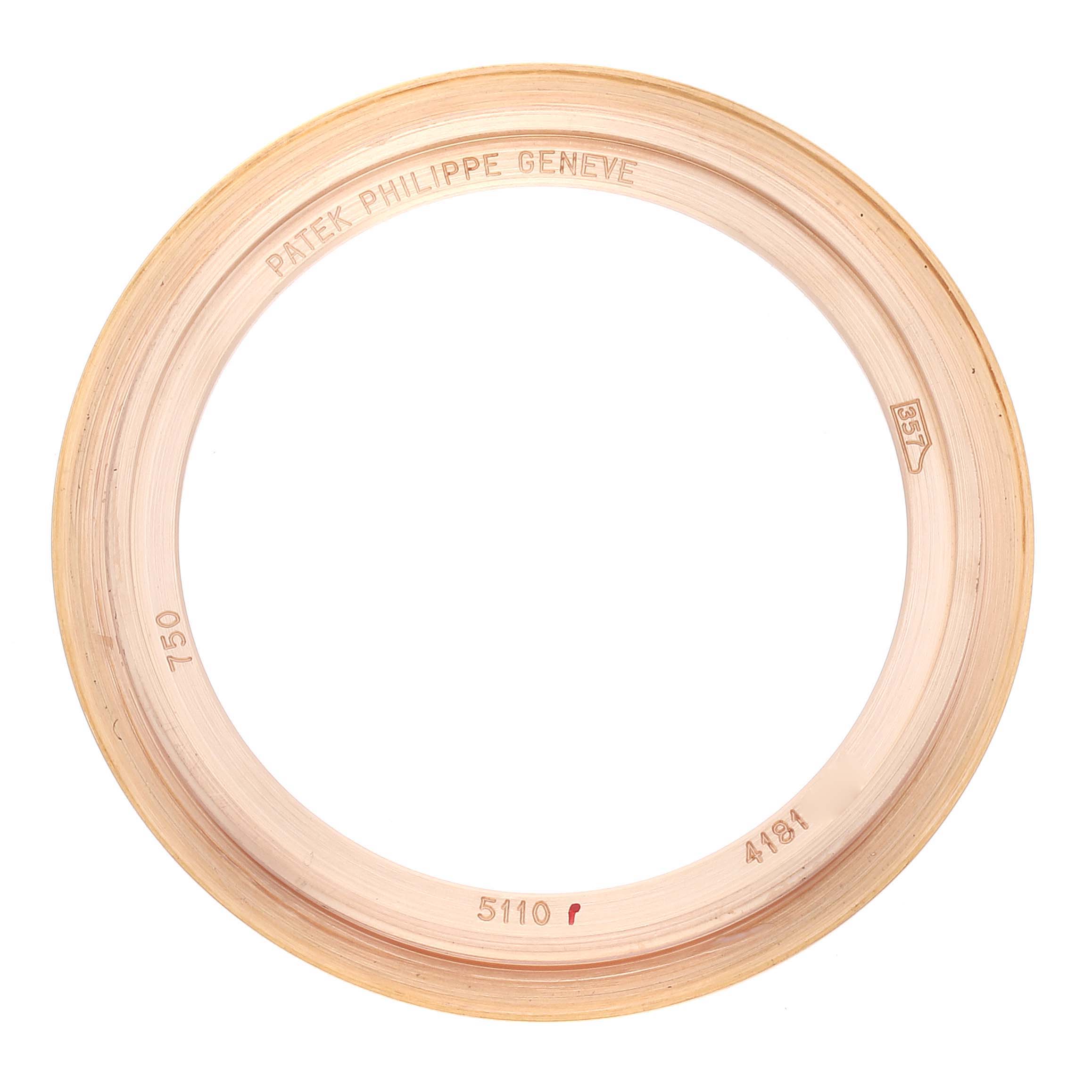 The image shows a bezel from a Complications model by Patek Philippe, viewed from above.