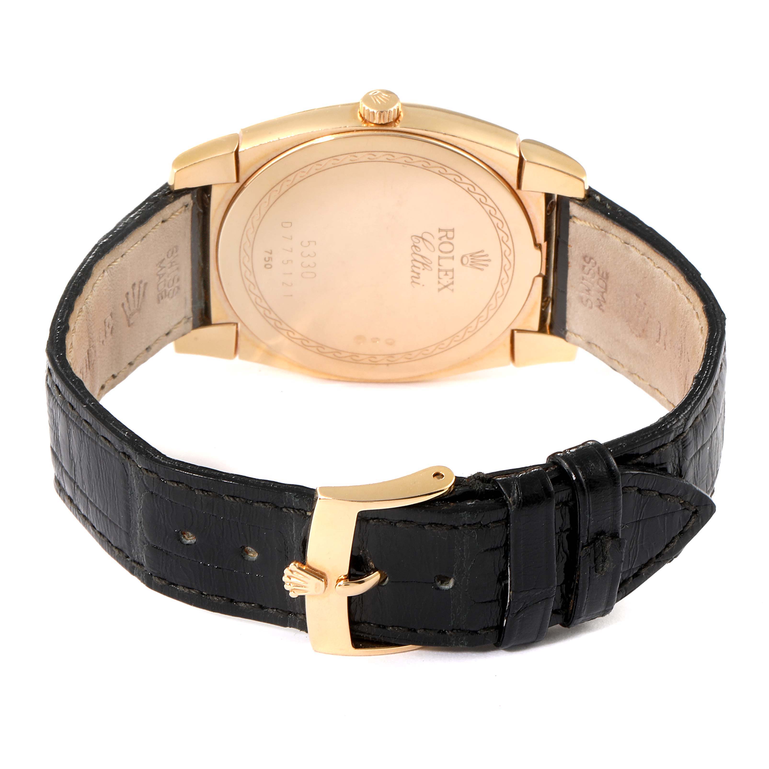 The image shows the back view of a Rolex Cellini 5330 Men's Rose Gold White Dial 5330 Men's Rose Gold White Dial watch, showcasing its black leather strap and gold buckle.