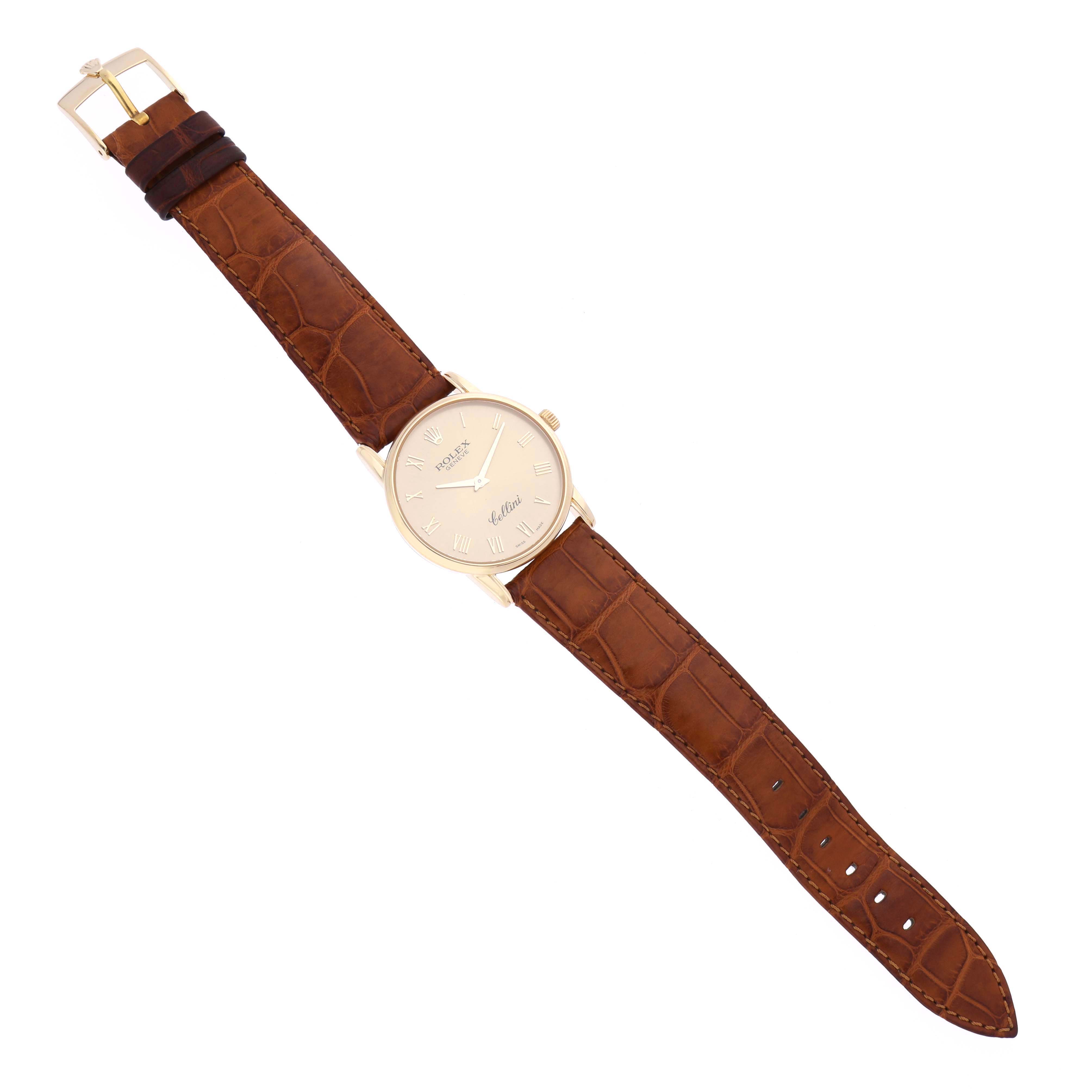 The Rolex Cellini 5116 Men's Yellow Gold Champagne Dial 5116 Men's Yellow Gold Champagne Dial watch is shown from a top view, displaying the face, bezel, strap, and buckle.