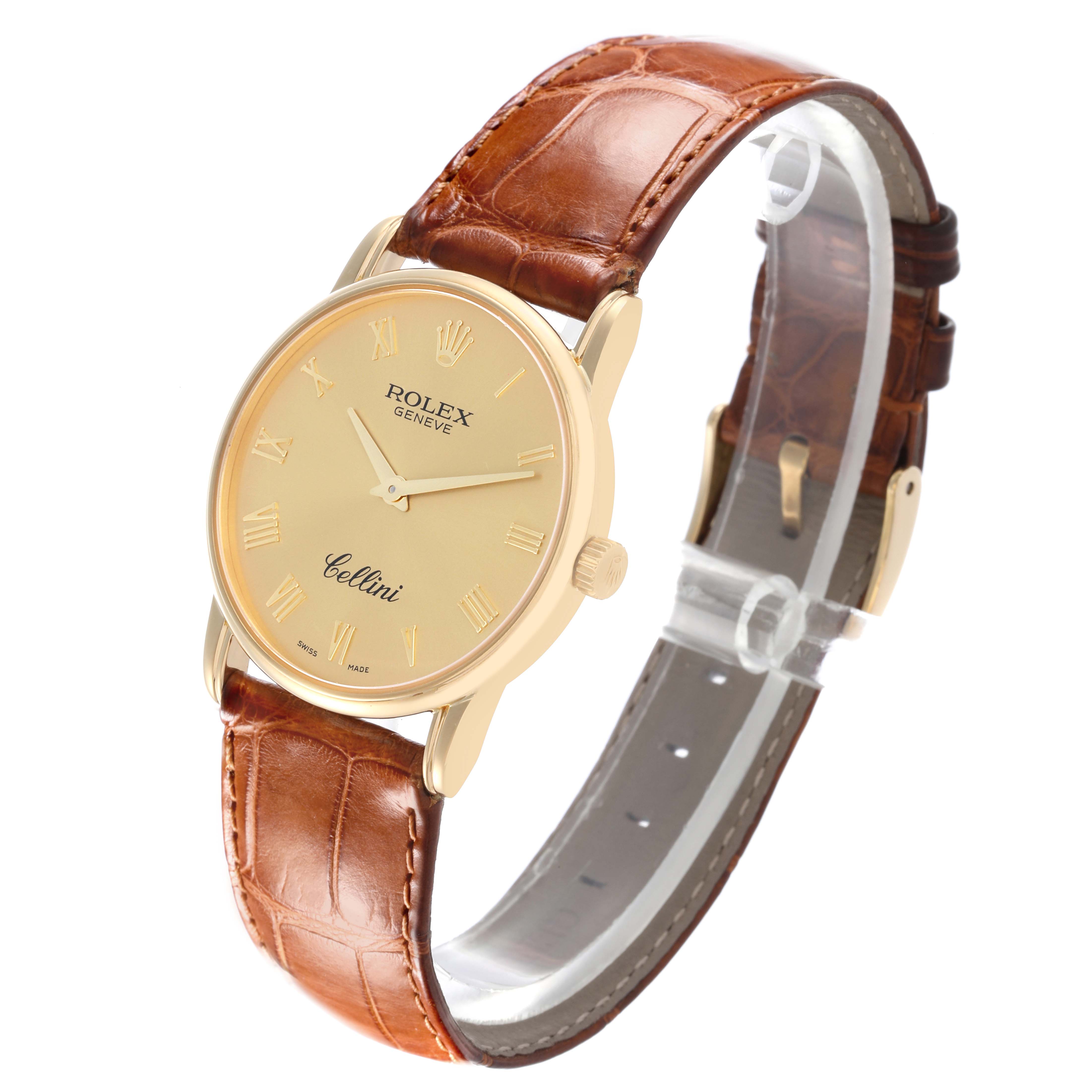 The Rolex Cellini 5116 Men's Yellow Gold Champagne Dial 5116 Men's Yellow Gold Champagne Dial watch is shown at a three-quarter angle, displaying the face, case, crown, and leather strap.