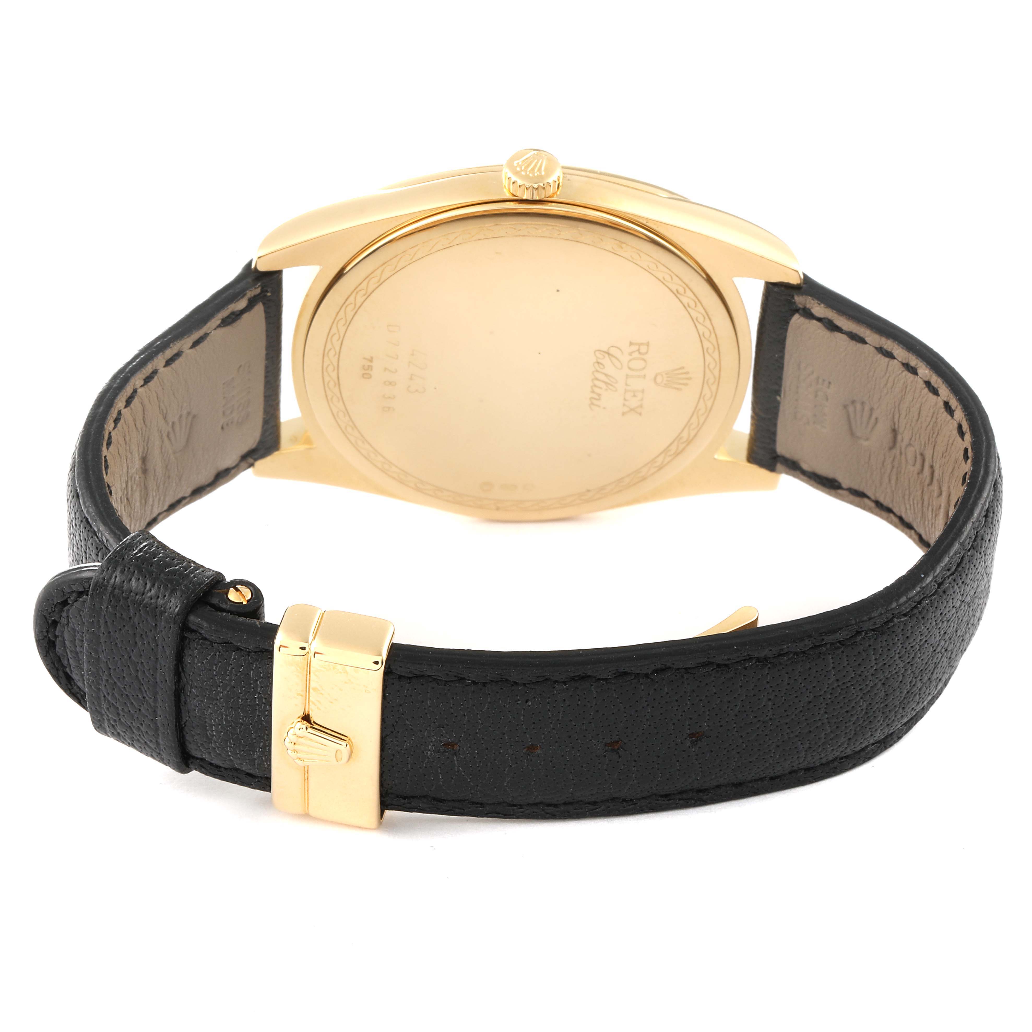 The image shows the back view of a Rolex Cellini 4243 Men's Yellow Gold White Dial 4243 Men's Yellow Gold White Dial watch, highlighting its case back and black leather strap with a gold buckle.