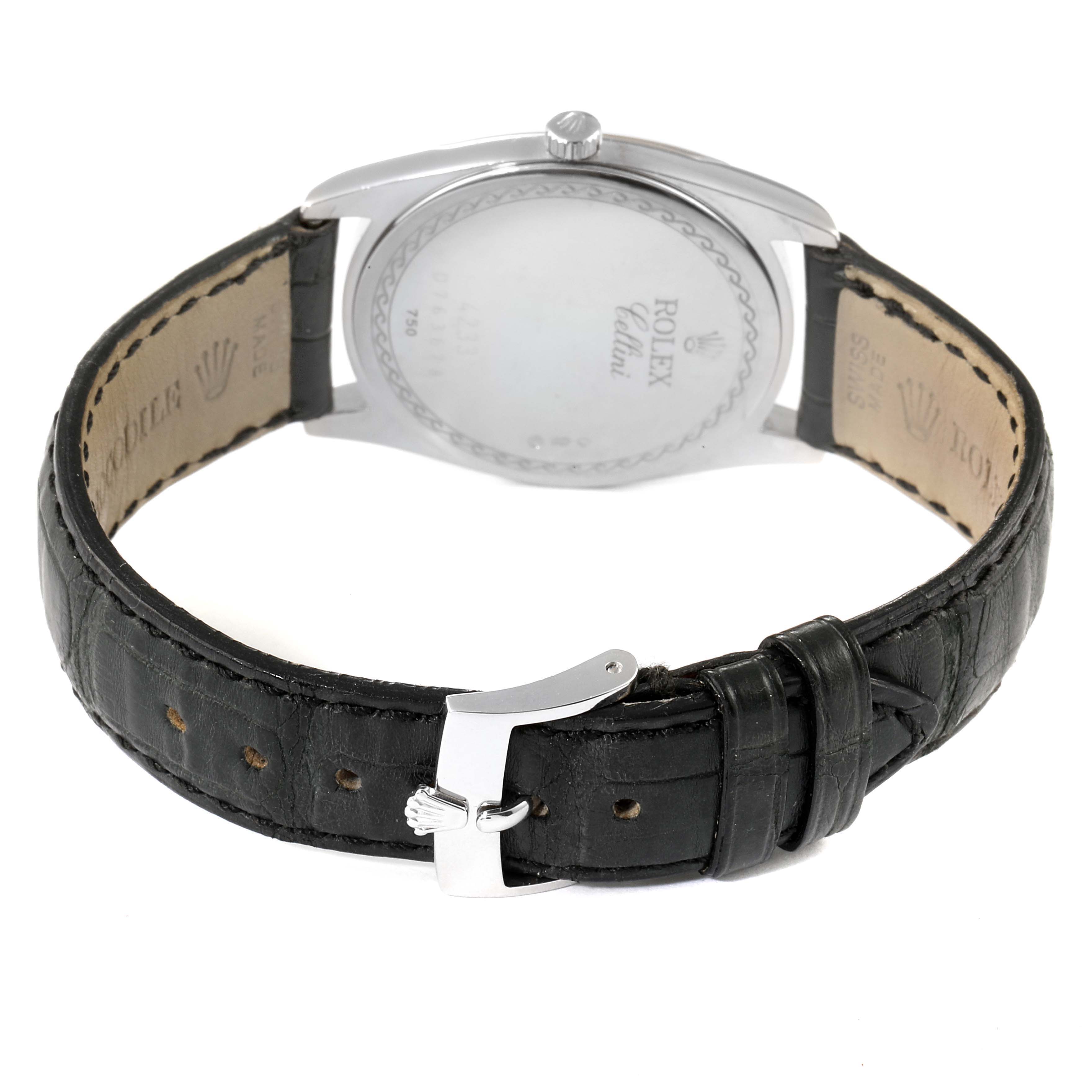The image shows the back view of the Rolex Cellini 4233 Men
s White Gold Black Dial 4233 Men
s White Gold Black Dial watch, featuring its leather strap and buckle.