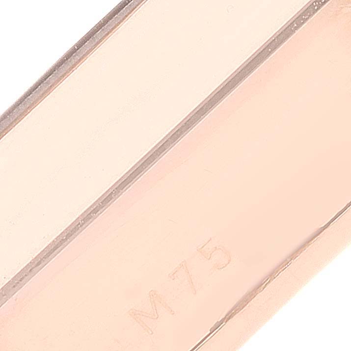 This image shows a close-up of a section from a Rolex Cellini 5442 Men's Rose Gold Black Dial 5442 Men's Rose Gold Black Dial watch band or strap.