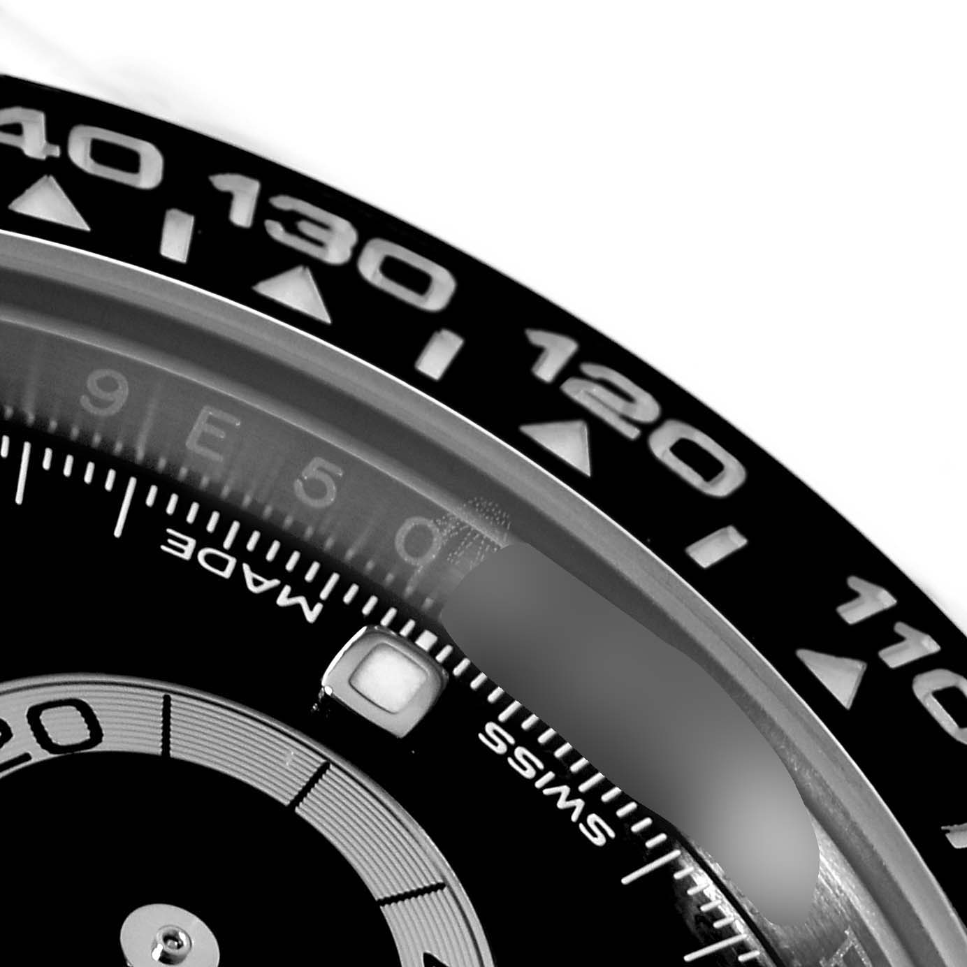 This close-up angle shows the bezel and part of the dial of the Rolex Daytona 116500 Men's Stainless Steel Black Dial 116500 Men's Stainless Steel Black Dial watch.