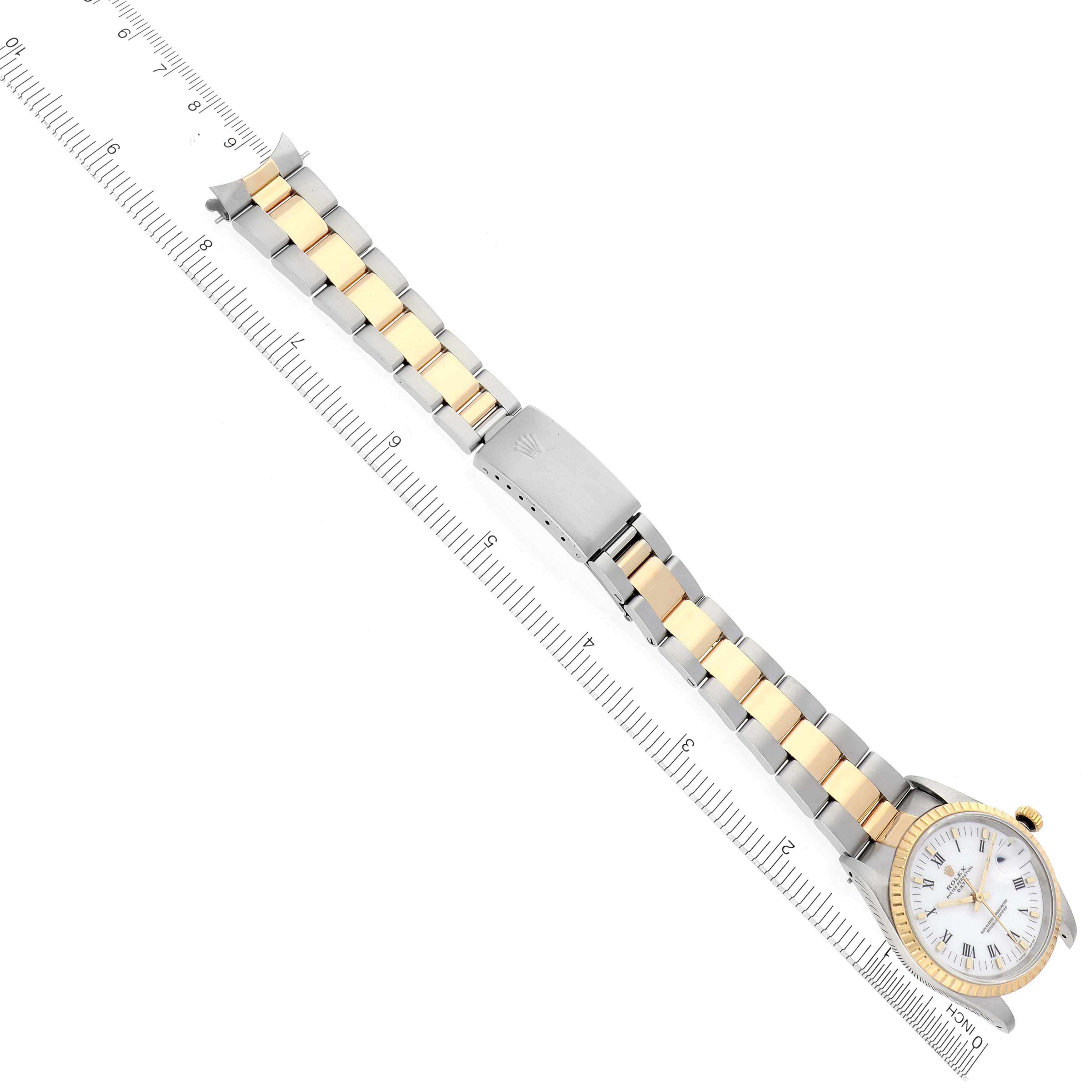 The Rolex Date 15223 Men's Steel and Gold (two tone) White Dial 15223 Men's Steel and Gold (two tone) White Dial watch is shown from above, highlighting the dial, bezel, bracelet, and clasp.