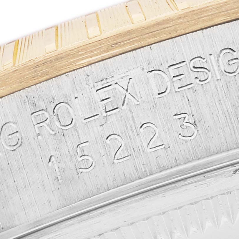 The image shows a close-up of the side of a Rolex Date 15223 Men's Steel and Gold (two tone) White Dial 15223 Men's Steel and Gold (two tone) White Dial model, displaying the engraved model number.
