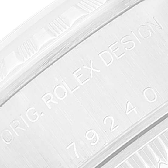 This close-up image shows the engraved text on the bezel of a Rolex Datejust 79240 Women's Stainless Steel Silver Dial 79240 Women's Stainless Steel Silver Dial watch.