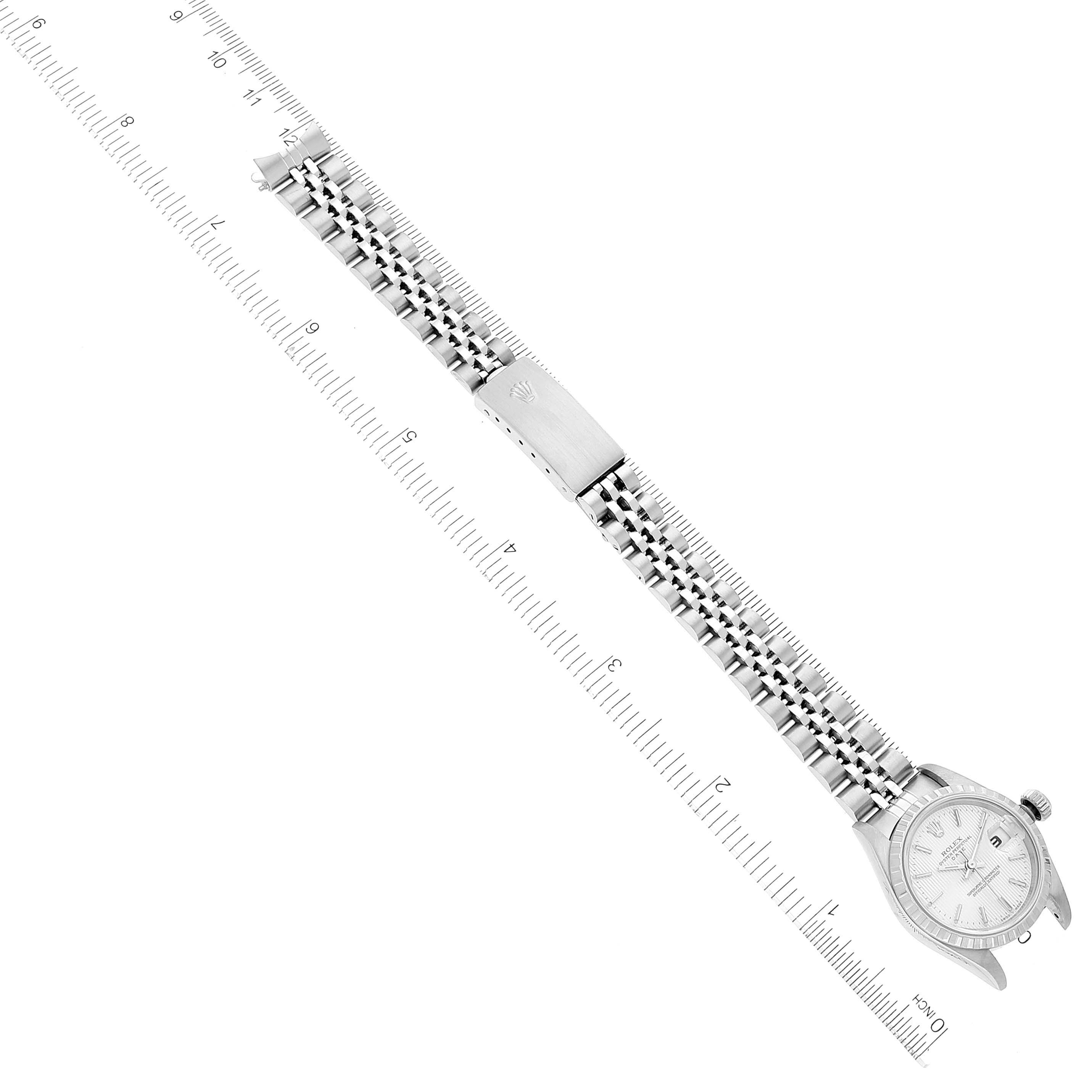 The image shows a Rolex Datejust 79240 Women's Stainless Steel Silver Dial 79240 Women's Stainless Steel Silver Dial watch laid flat, with a ruler alongside, displaying the bracelet and case from a top-down angle.