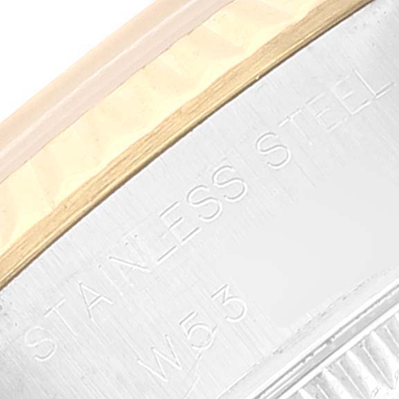 This image shows a close-up of the edge of a Rolex Datejust 69173 Women's Steel and Gold (two tone) Champagne Dial 69173 Women's Steel and Gold (two tone) Champagne Dial watch, highlighting the "Stainless Steel" engraving.