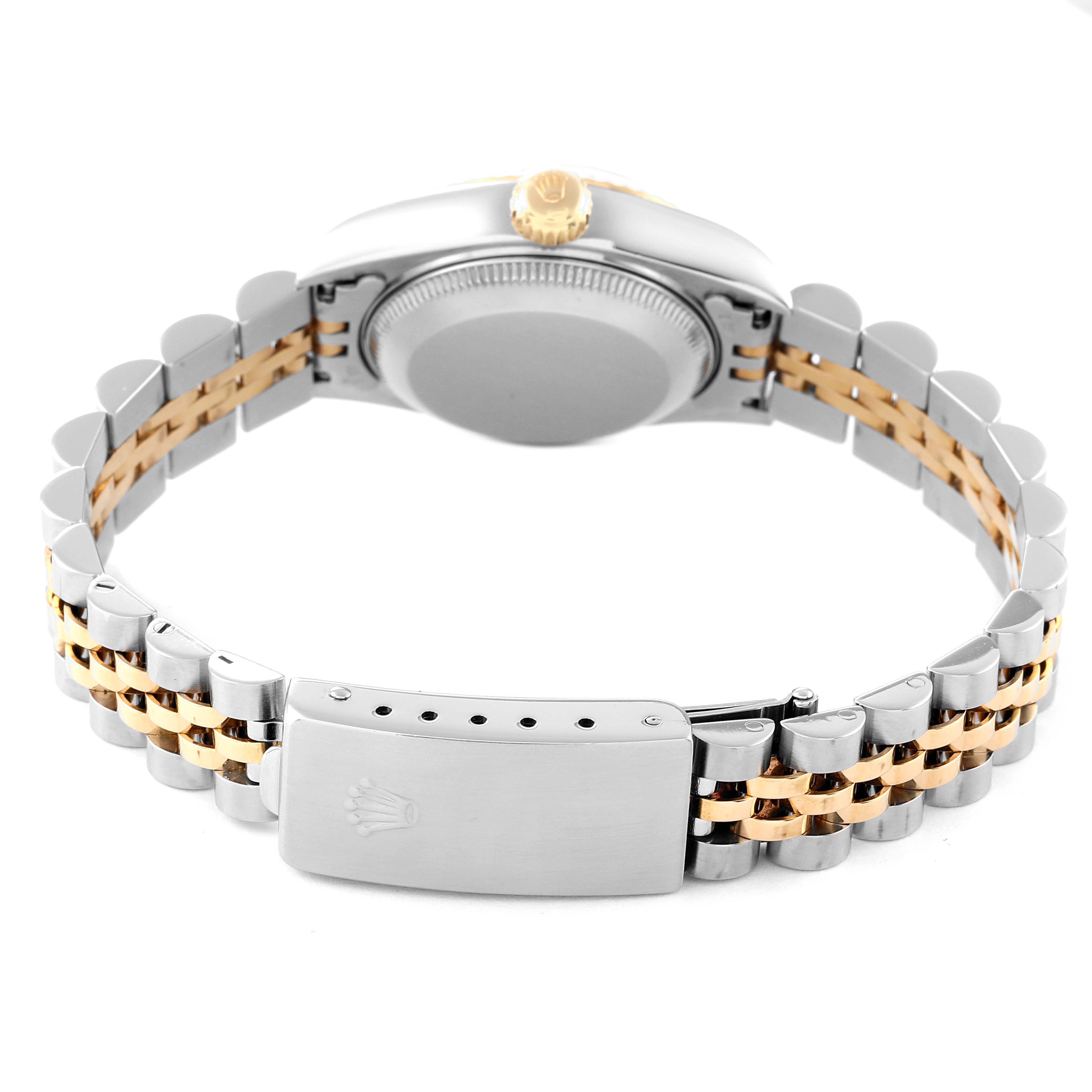 This Rolex Datejust 69173 Women's Steel and Gold (two tone) Champagne Dial 69173 Women's Steel and Gold (two tone) Champagne Dial watch is shown from the back, highlighting the case back, crown, and two-tone metal bracelet with the clasp.