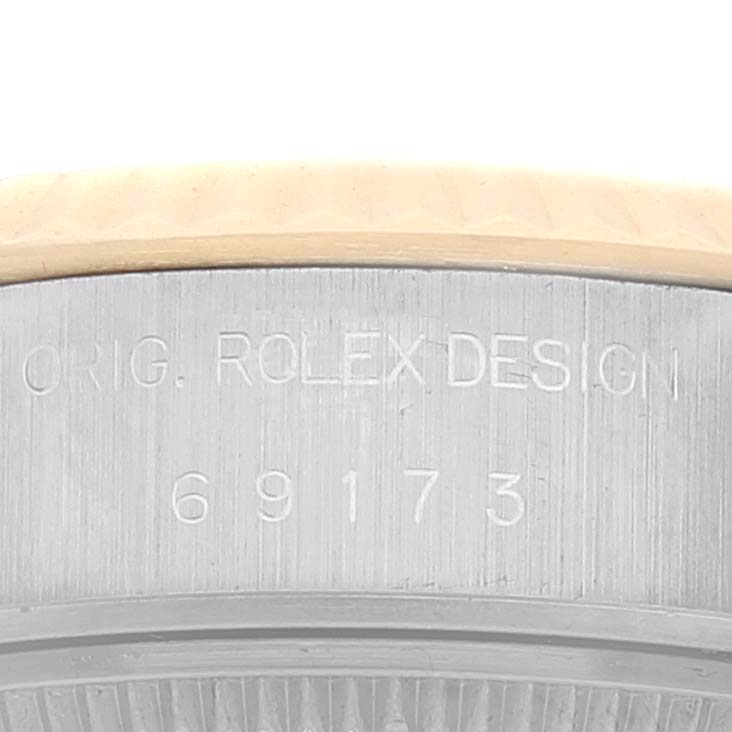The image shows a close-up of the case side of a Rolex Datejust 69173 Women's Steel and Gold (two tone) Champagne Dial 69173 Women's Steel and Gold (two tone) Champagne Dial watch, revealing the model number and branding.