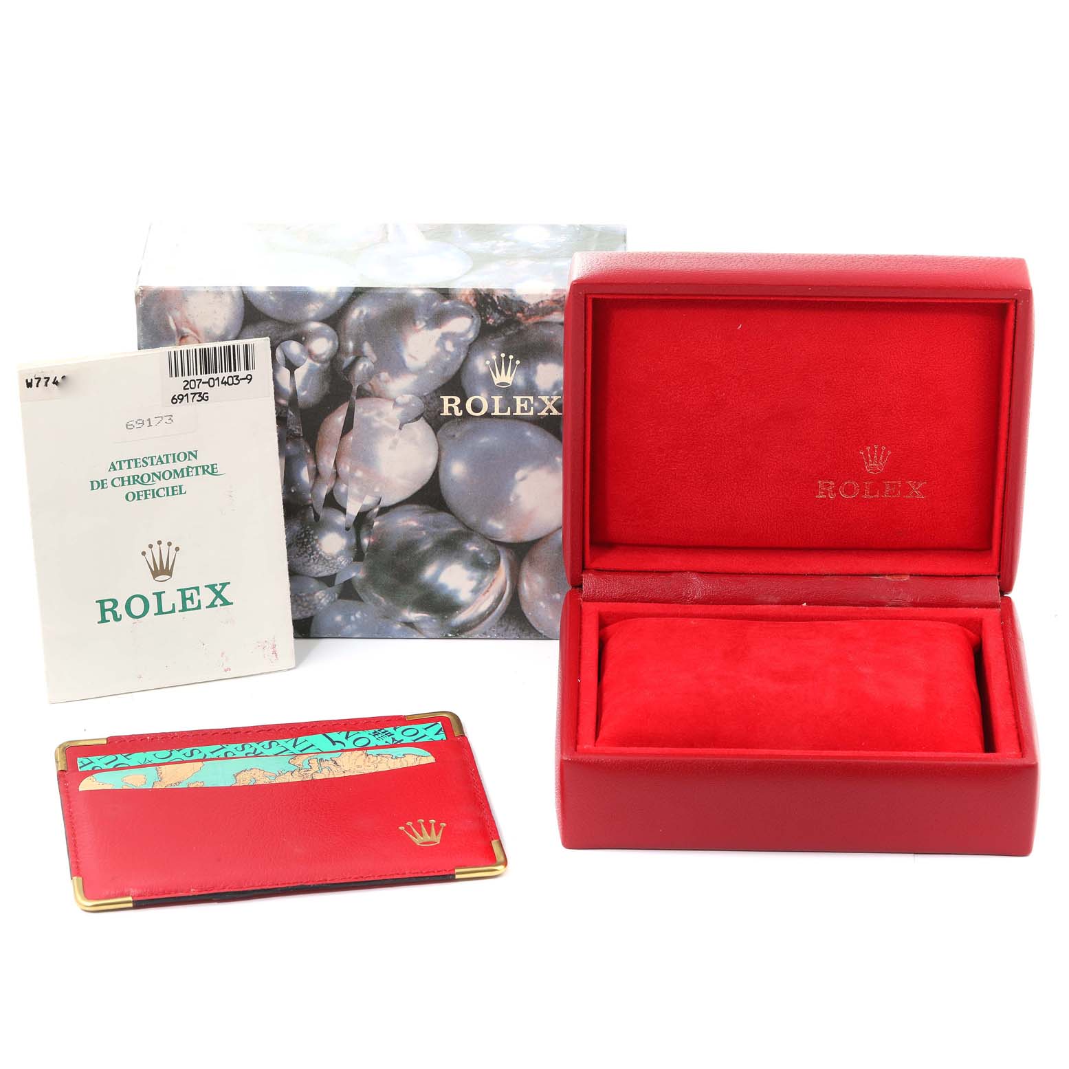 The image shows a Rolex Datejust 69173 Women's Steel and Gold (two tone) Champagne Dial 69173 Women's Steel and Gold (two tone) Champagne Dial watch box, documentation, and a cardholder from a front angle.