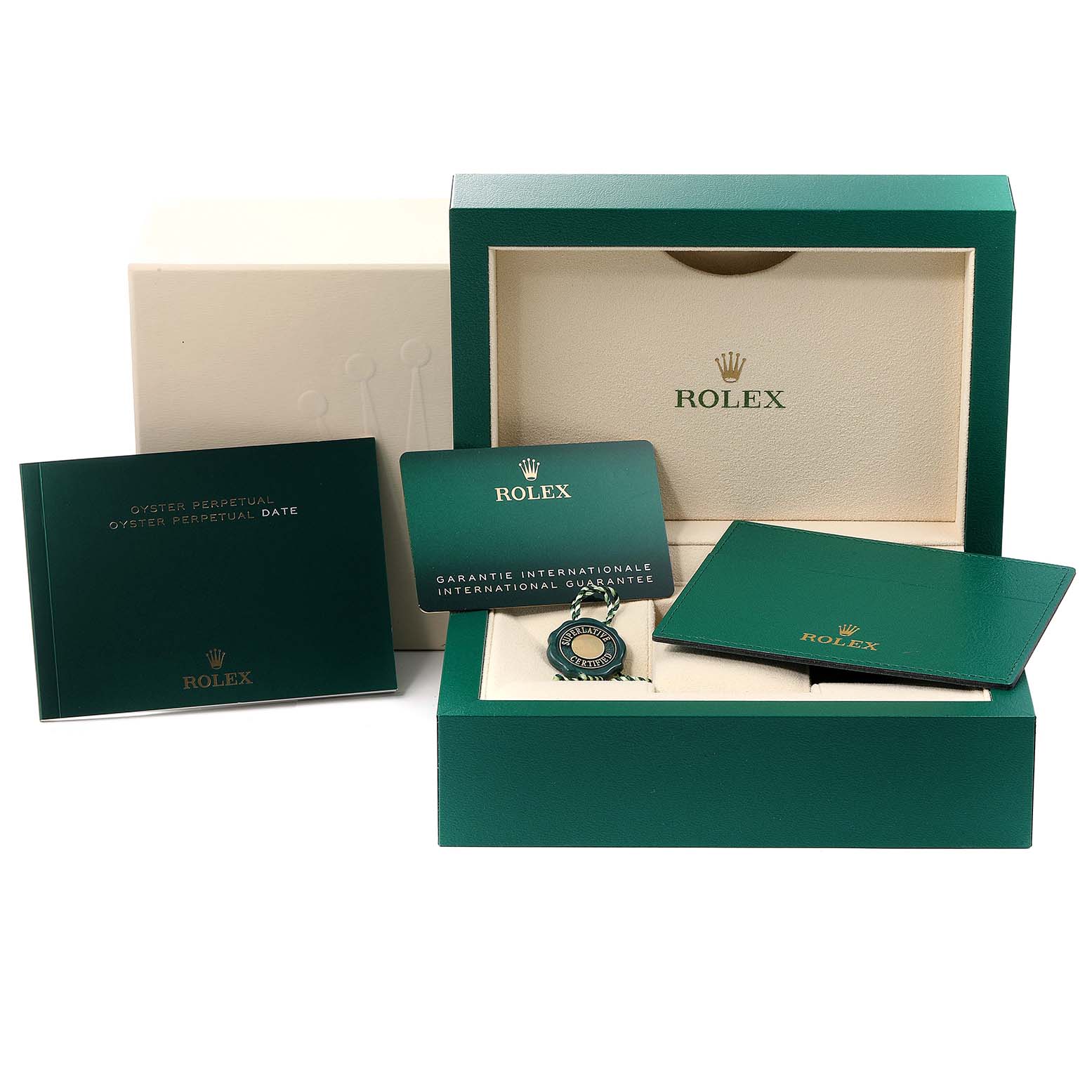 The image shows accessories for the Mid-Size Rolex, including the box, guarantee card, manuals, and tag from a frontal angle.