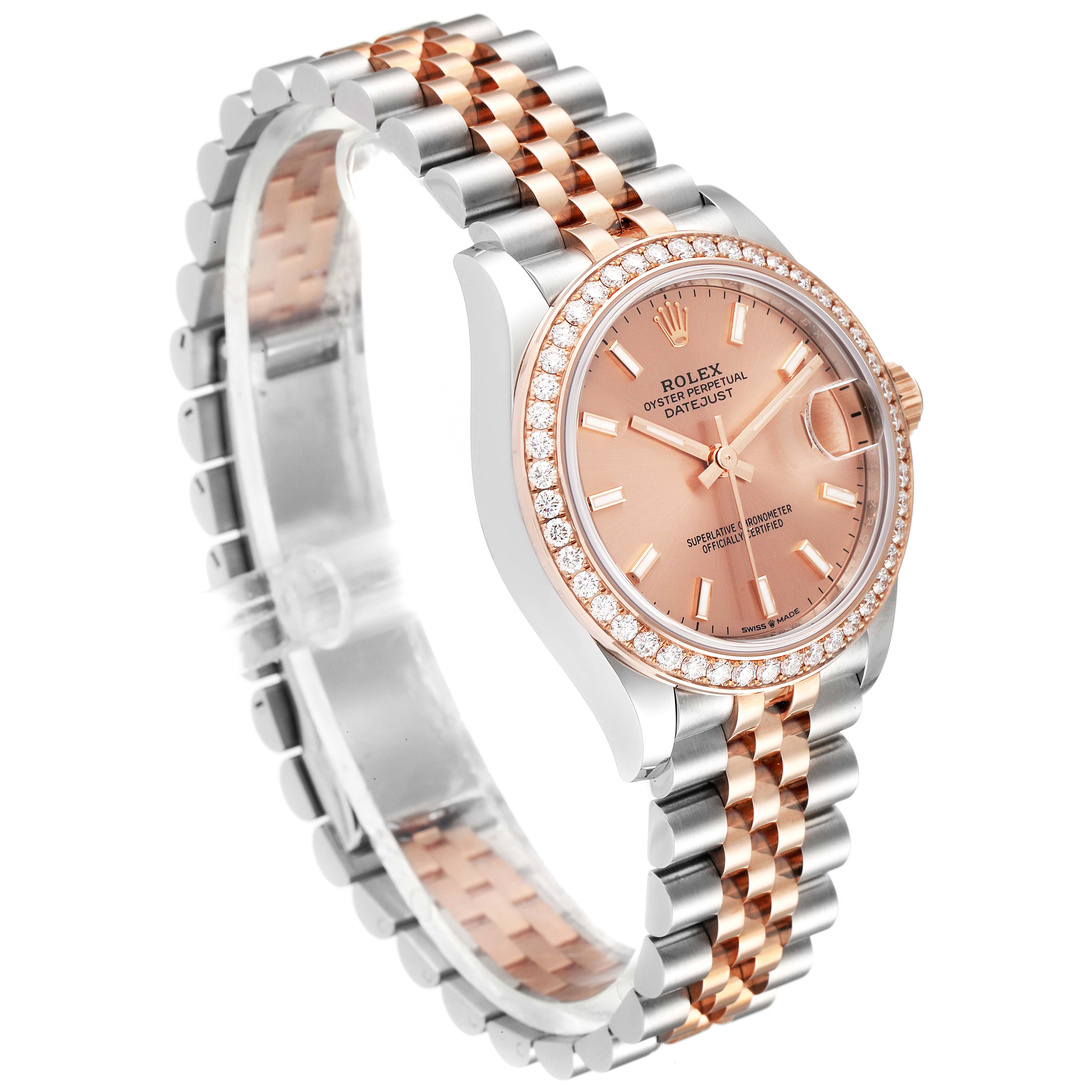 This Rolex Mid-Size 278381 Women's Steel and Gold (two tone) Pink Dial 278381 Women's Steel and Gold (two tone) Pink Dial Datejust watch is shown at a slight angle, displaying its bezel, dial, and two-tone bracelet.