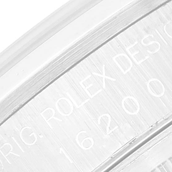 The image shows an engraved part of the inner bezel of the Rolex Datejust 16200 Men's Stainless Steel Silver Dial 16200 Men's Stainless Steel Silver Dial watch.