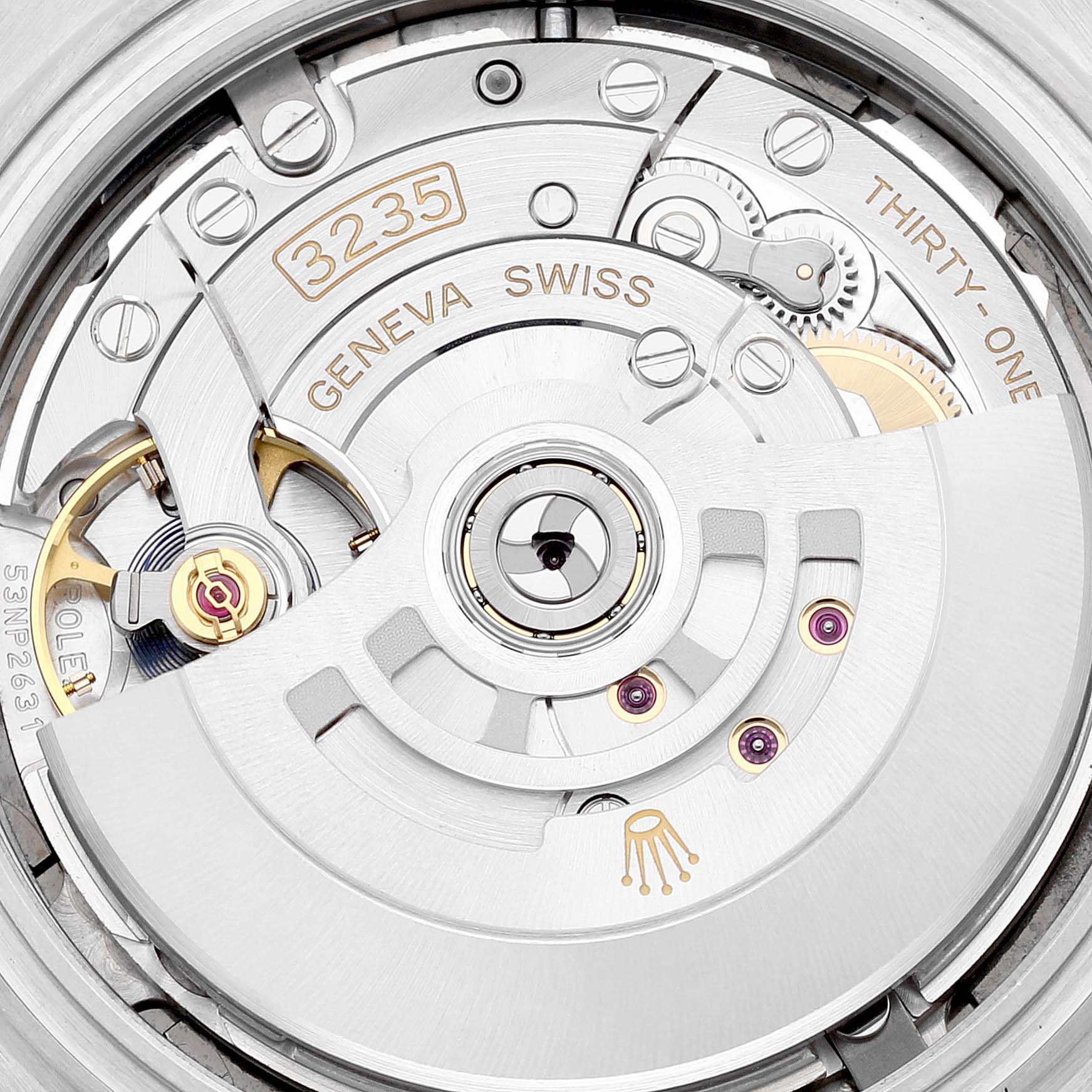 The image shows a close-up view of the movement of a Rolex Datejust 41 126331 Men's Steel and Gold (two tone) Grey Dial 126331 Men's Steel and Gold (two tone) Grey Dial, revealing the 3235 caliber and intricate mechanical parts.
