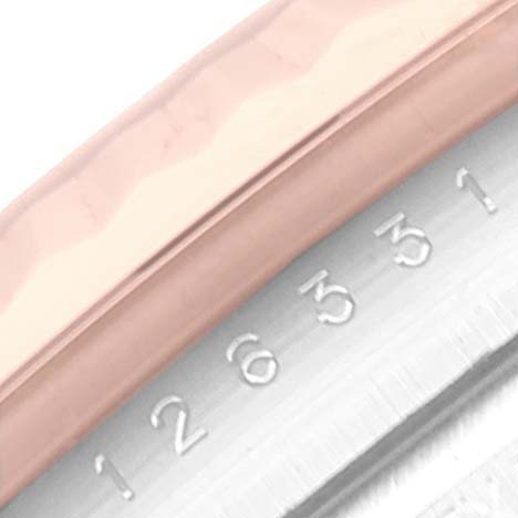 The image shows an angled close-up of the Datejust 41 model by Rolex, featuring the fluted bezel and part of the engraved serial number.