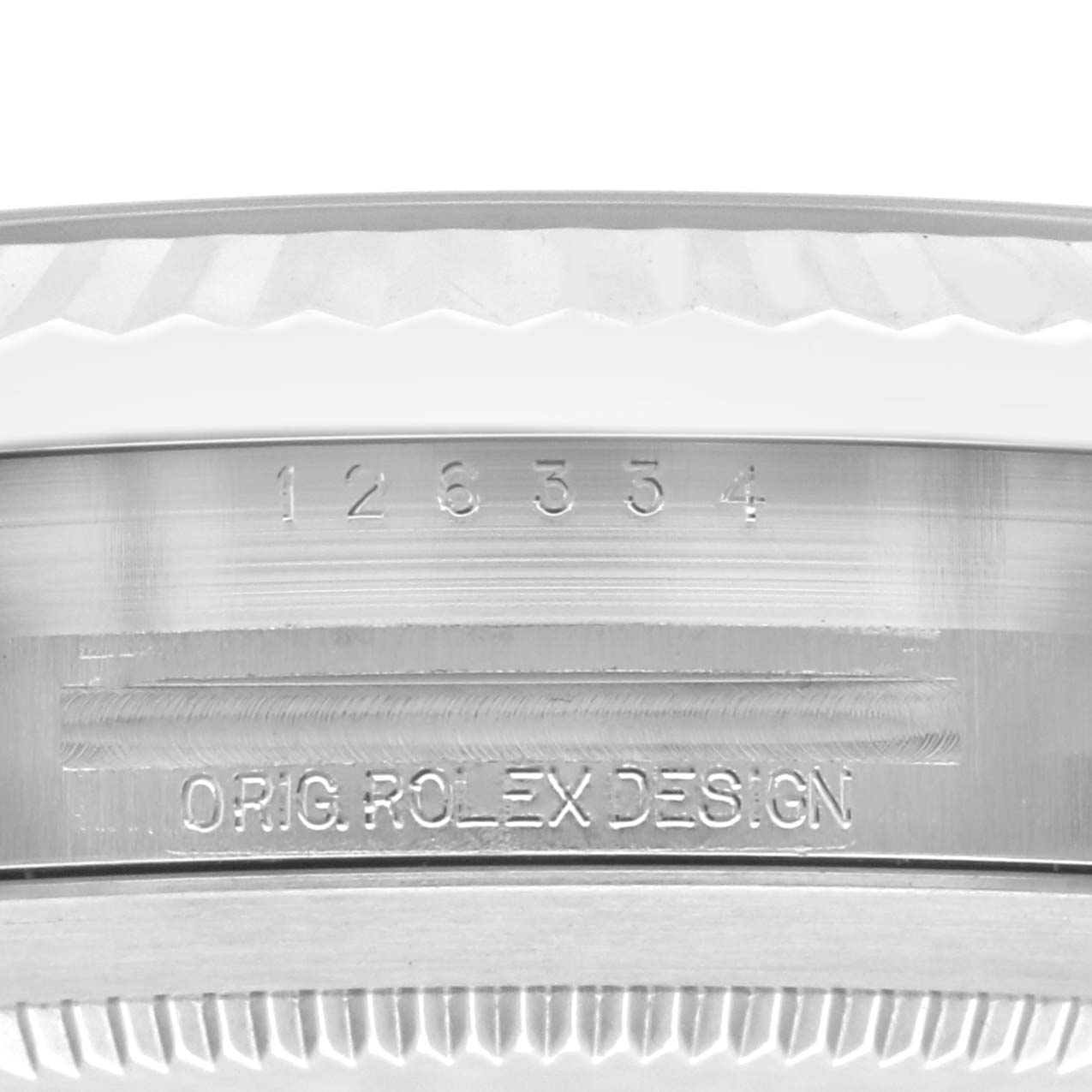 The image shows the engraved side of the case of a Rolex Datejust 41 126334 Men
s Stainless Steel Blue Dial 126334 Men
s Stainless Steel Blue Dial, featuring the serial number and "ORIG ROLEX DESIGN."