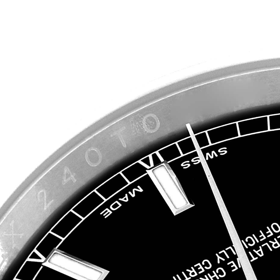 This image shows a partial close-up of the dial and bezel of a Rolex Datejust 116200 Men's Stainless Steel Black Dial 116200 Men's Stainless Steel Black Dial watch.