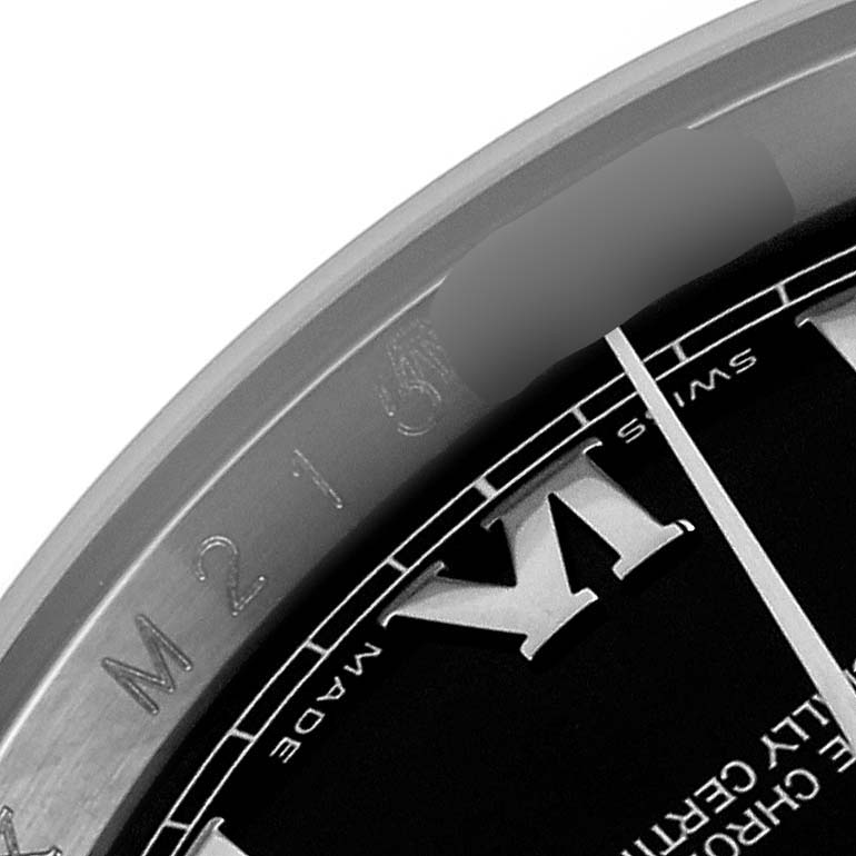 The image shows a close-up of the bezel and partial dial of a Rolex Datejust 116200 Men's Stainless Steel Black Dial 116200 Men's Stainless Steel Black Dial watch, focusing on the numbering and "Swiss Made" text.