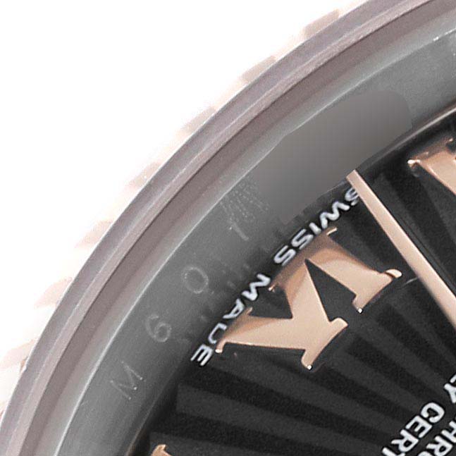 The image shows a close-up of the bezel and part of the dial of a Rolex Datejust 179171 Women's Steel and Gold (two tone) Black Dial 179171 Women's Steel and Gold (two tone) Black Dial watch.