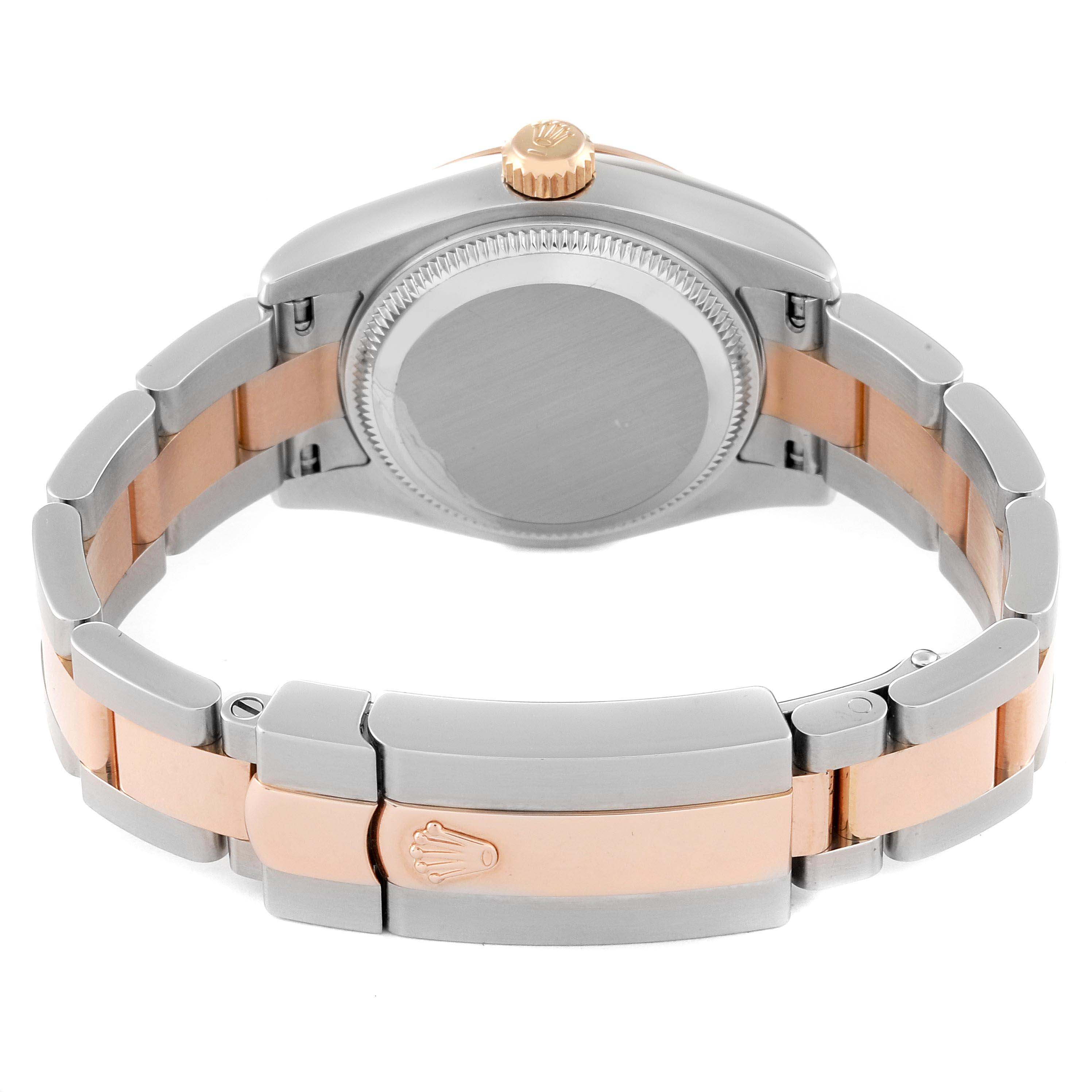 The image shows the back view of a Rolex Datejust 179171 Women's Steel and Gold (two tone) Black Dial 179171 Women's Steel and Gold (two tone) Black Dial watch, highlighting its case back, crown, and two-tone bracelet clasp.