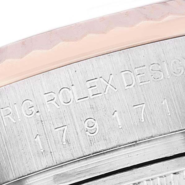 Close-up of a Rolex Datejust 179171 Women's Steel and Gold (two tone) Black Dial 179171 Women's Steel and Gold (two tone) Black Dial showing the engraved model number and part of the bezel.