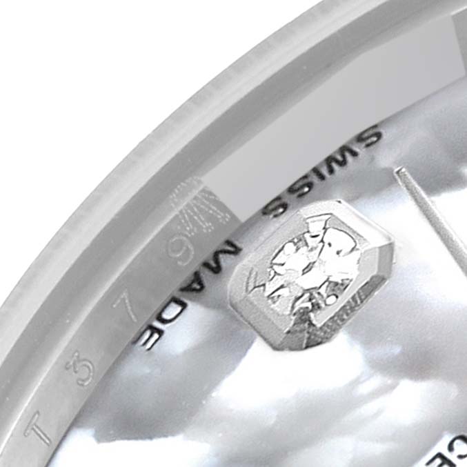 This is a close-up of the dial part of a Rolex Mid-Size 178274 Women's Stainless Steel Mother of Pearl Dial 178274 Women's Stainless Steel Mother of Pearl Dial watch showing the "Swiss Made" text and a diamond marker.