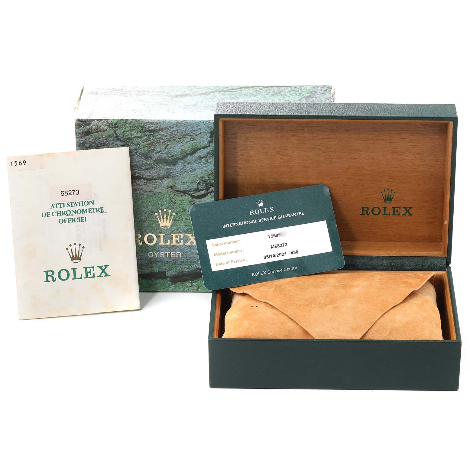 The image shows the packaging box, service guarantee card, and paperwork for a Rolex Mid-Size 68273 Women
s Steel and Gold (two tone) White Dial 68273 Women
s Steel and Gold (two tone) White Dial model.