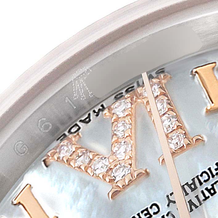 A close-up of the Rolex Datejust 179171 Women's Steel and Gold (two tone) Mother of Pearl Dial 179171 Women's Steel and Gold (two tone) Mother of Pearl Dial watch, showing part of the bezel, dial, and a portion of the Roman numeral XI adorned with diamonds.