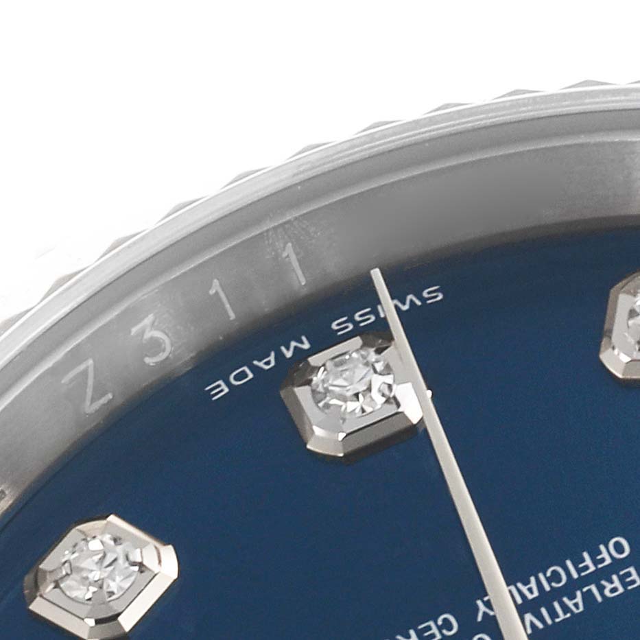 The image shows a close-up of the Rolex Datejust 116234 Men
s Stainless Steel Blue Dial 116234 Men
s Stainless Steel Blue Dial watch, featuring the bezel and part of the dial with diamond markers.