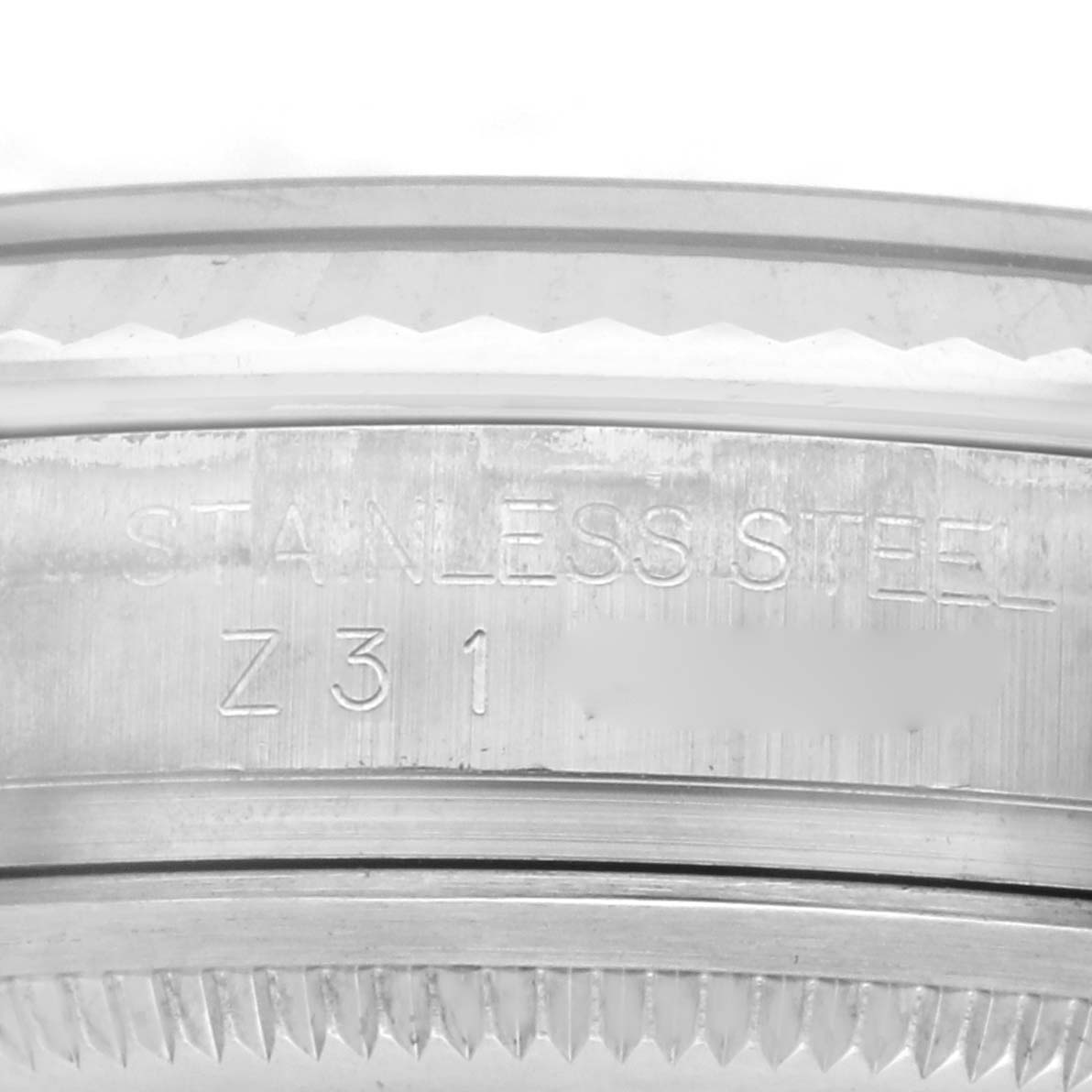 The image shows a close-up of the stainless steel casing edge and engravings of the Rolex Datejust 116234 Men
s Stainless Steel Blue Dial 116234 Men
s Stainless Steel Blue Dial watch.