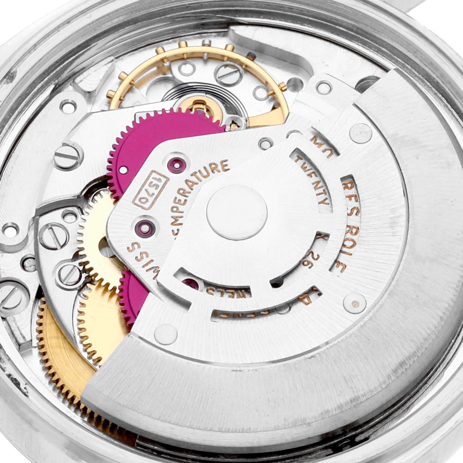 This is a close-up view of the movement mechanism in a Vintage Collection Rolex watch, showing gears and the rotor.