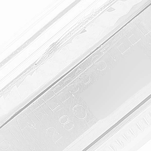 This is a close-up image showing part of the stainless steel casing of the Rolex Vintage Collection 1601 Men
s Stainless Steel Grey Dial 1601 Men
s Stainless Steel Grey Dial watch.