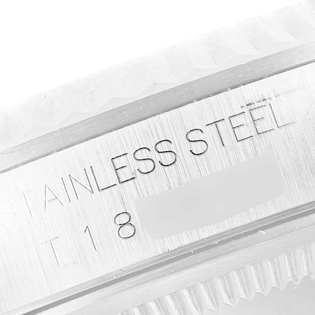 The image shows a close-up angle of the stainless steel construction and partial engraving on the Rolex Datejust 16234 Men's Stainless Steel Silver Dial 16234 Men's Stainless Steel Silver Dial model.