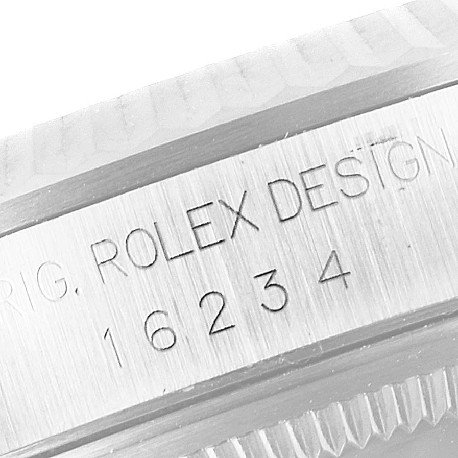 The image shows a close-up of the case's side engraving on a Rolex Datejust 16234 Men's Stainless Steel Silver Dial 16234 Men's Stainless Steel Silver Dial model, displaying the "ROLEX DESIGN" and model number "16234".