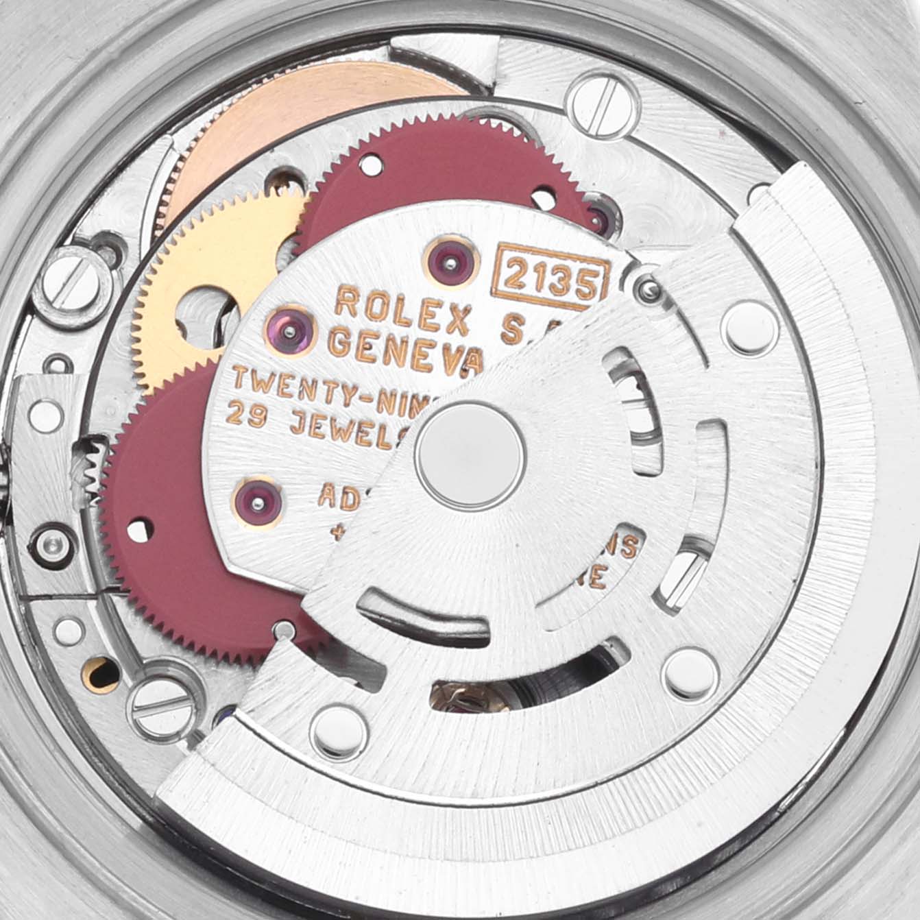 The image shows the movement of a Rolex Datejust 69173G Women's Steel and Gold (two tone) Champagne Dial 69173G Women's Steel and Gold (two tone) Champagne Dial watch from the back, highlighting gears and engraving details.