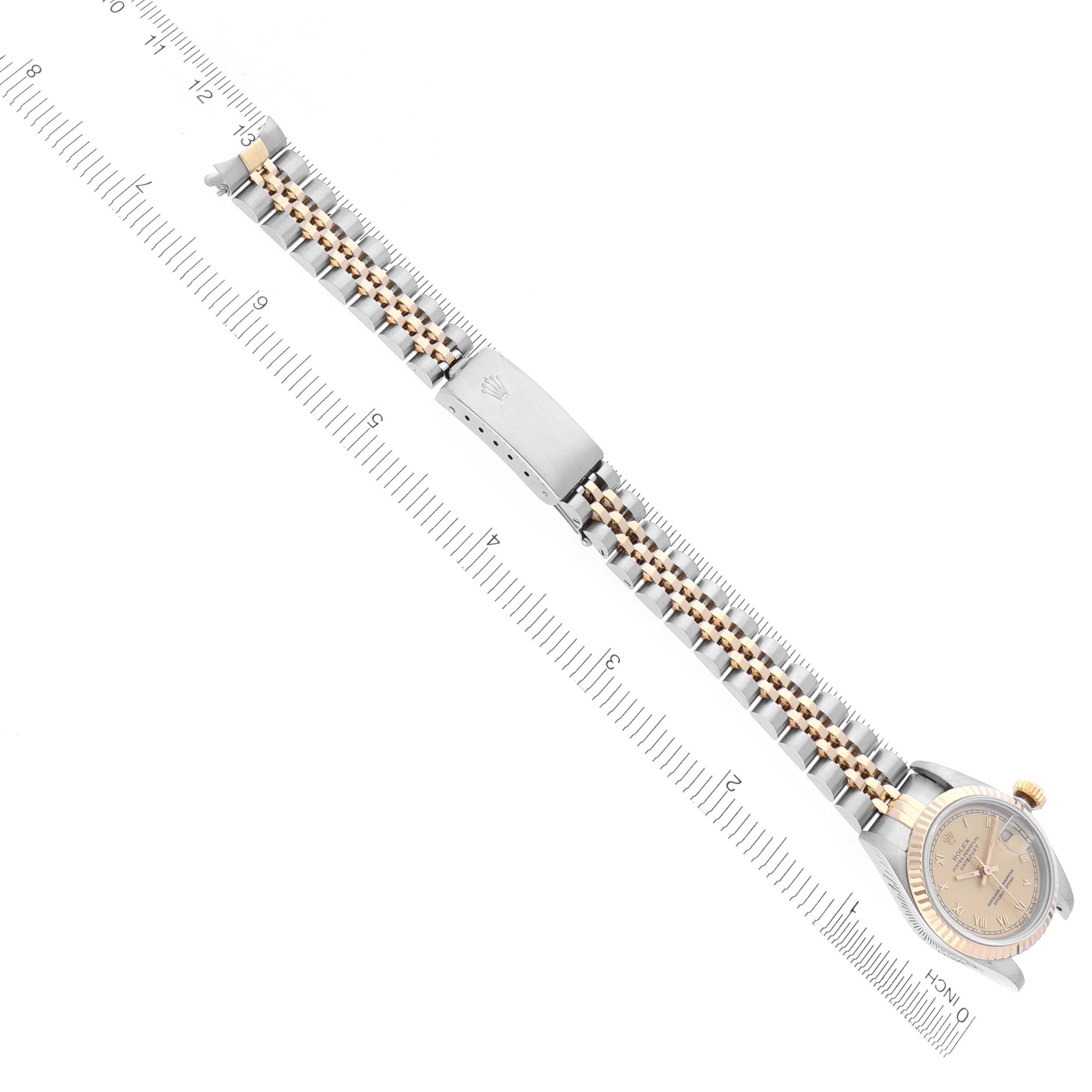 The Rolex Datejust 69173G Women's Steel and Gold (two tone) Champagne Dial 69173G Women's Steel and Gold (two tone) Champagne Dial watch is shown from an overhead angle, displaying its bracelet and clasp.