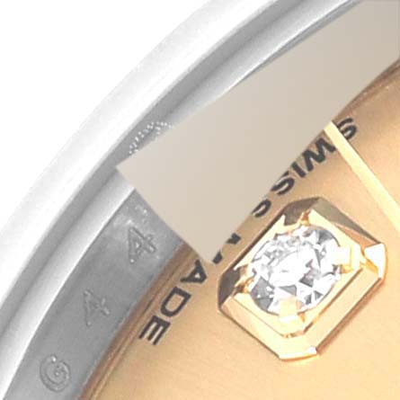 The image shows a close-up of the Rolex Datejust 179173 Women's Steel and Gold (two tone) Champagne Dial 179173 Women's Steel and Gold (two tone) Champagne Dial watch dial, focusing on a diamond marker and partial bezel with "MADE" visible.