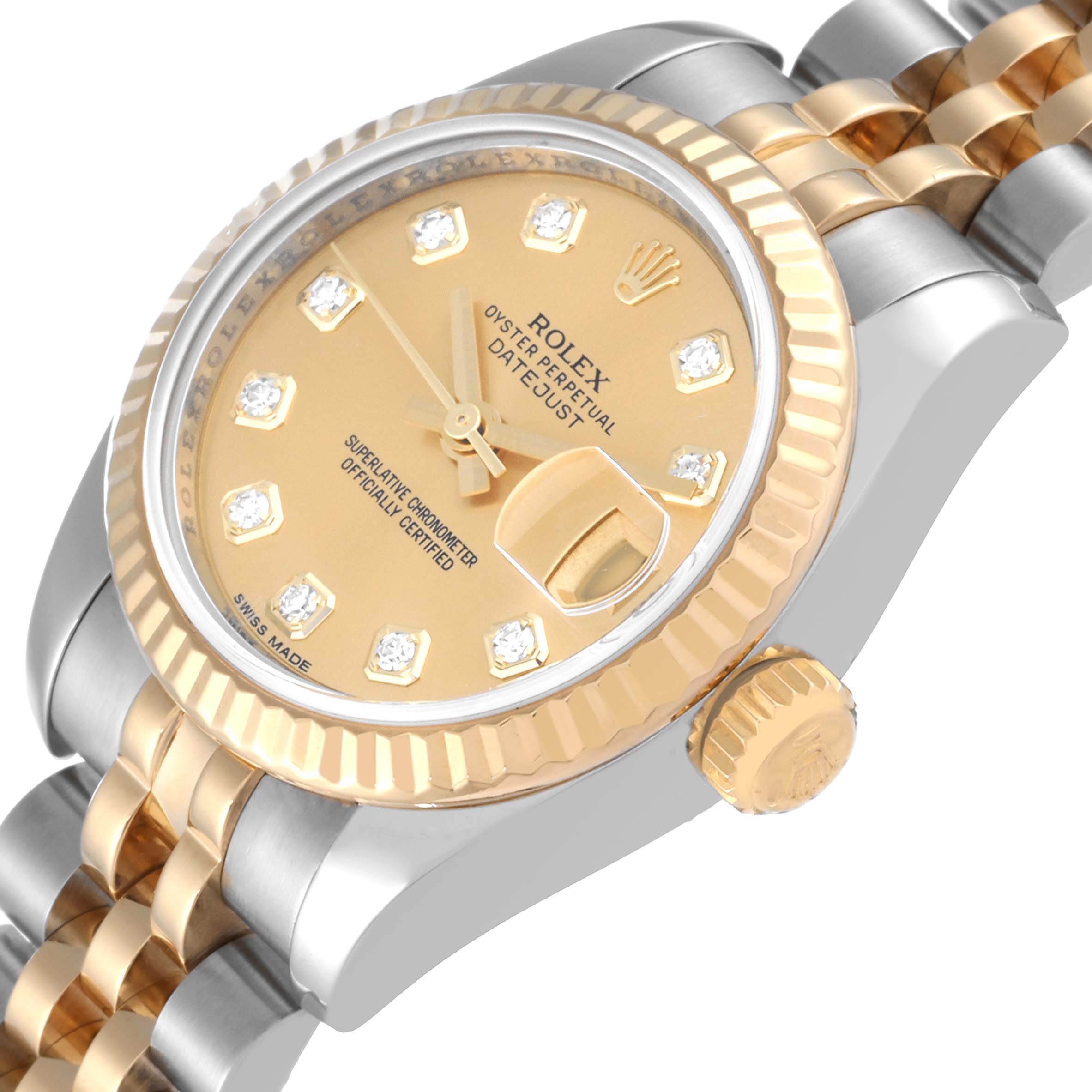 This image displays a close-up, angled view of a Rolex Datejust 179173 Women's Steel and Gold (two tone) Champagne Dial 179173 Women's Steel and Gold (two tone) Champagne Dial watch, showcasing its dial, bezel, crown, and part of the bracelet.