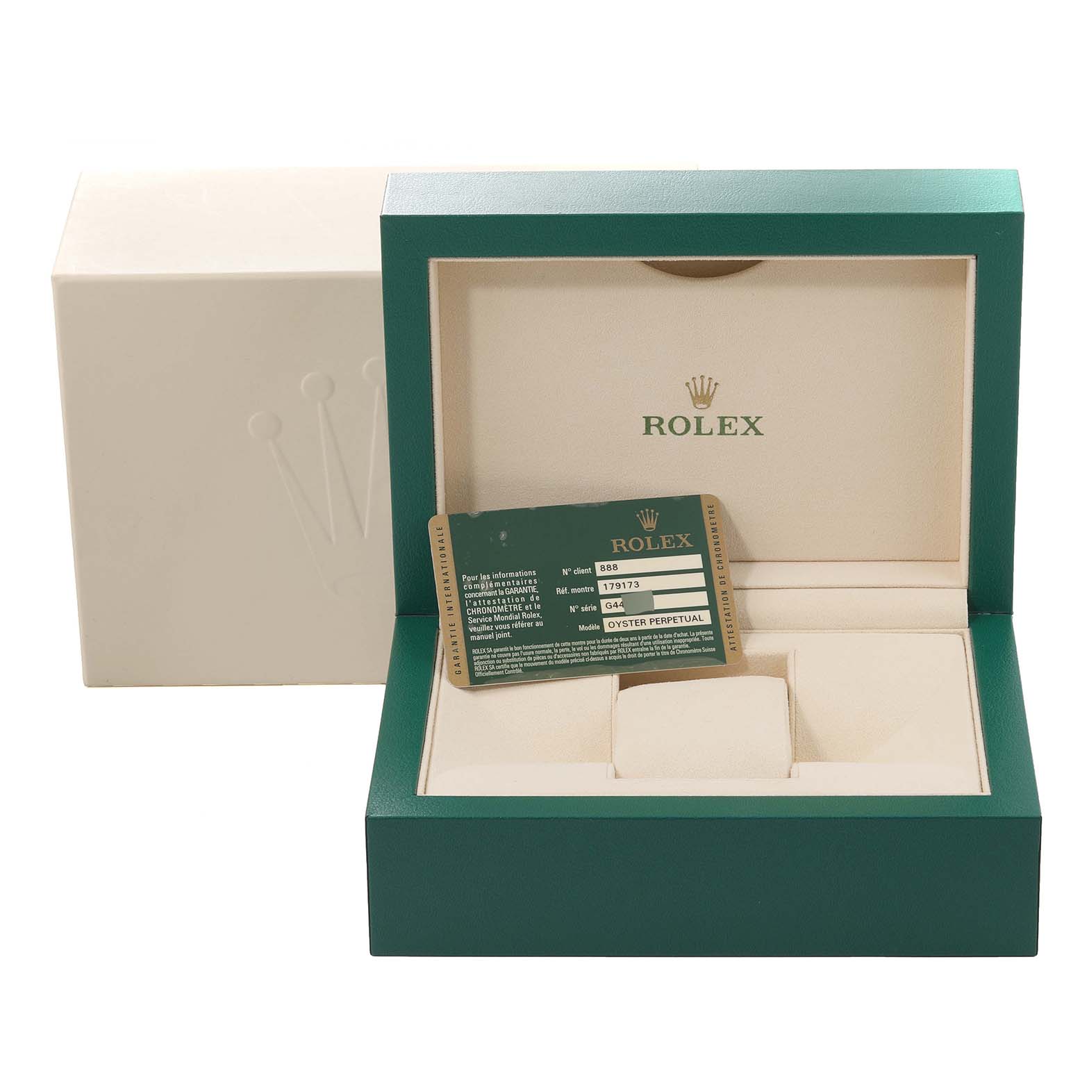 The image shows an open Rolex box for the Datejust model, displaying an empty cushion and warranty card inside.