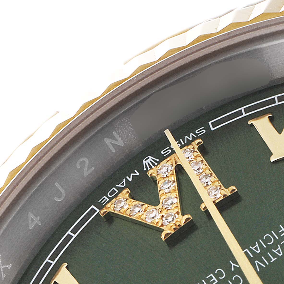 The image shows an angled close-up of the dial, crown, and part of the bezel of a Rolex Datejust 126233 Men's Steel and Gold (two tone) Green Dial 126233 Men's Steel and Gold (two tone) Green Dial watch.