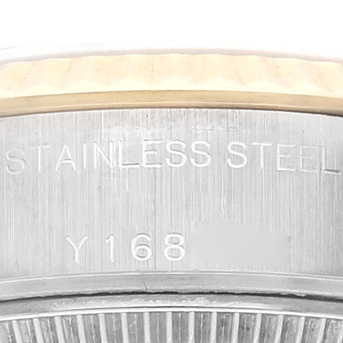This image shows a close-up of the case back with some engraved text of a Rolex Datejust 79173 Women's Steel and Gold (two tone) Silver Dial 79173 Women's Steel and Gold (two tone) Silver Dial watch.