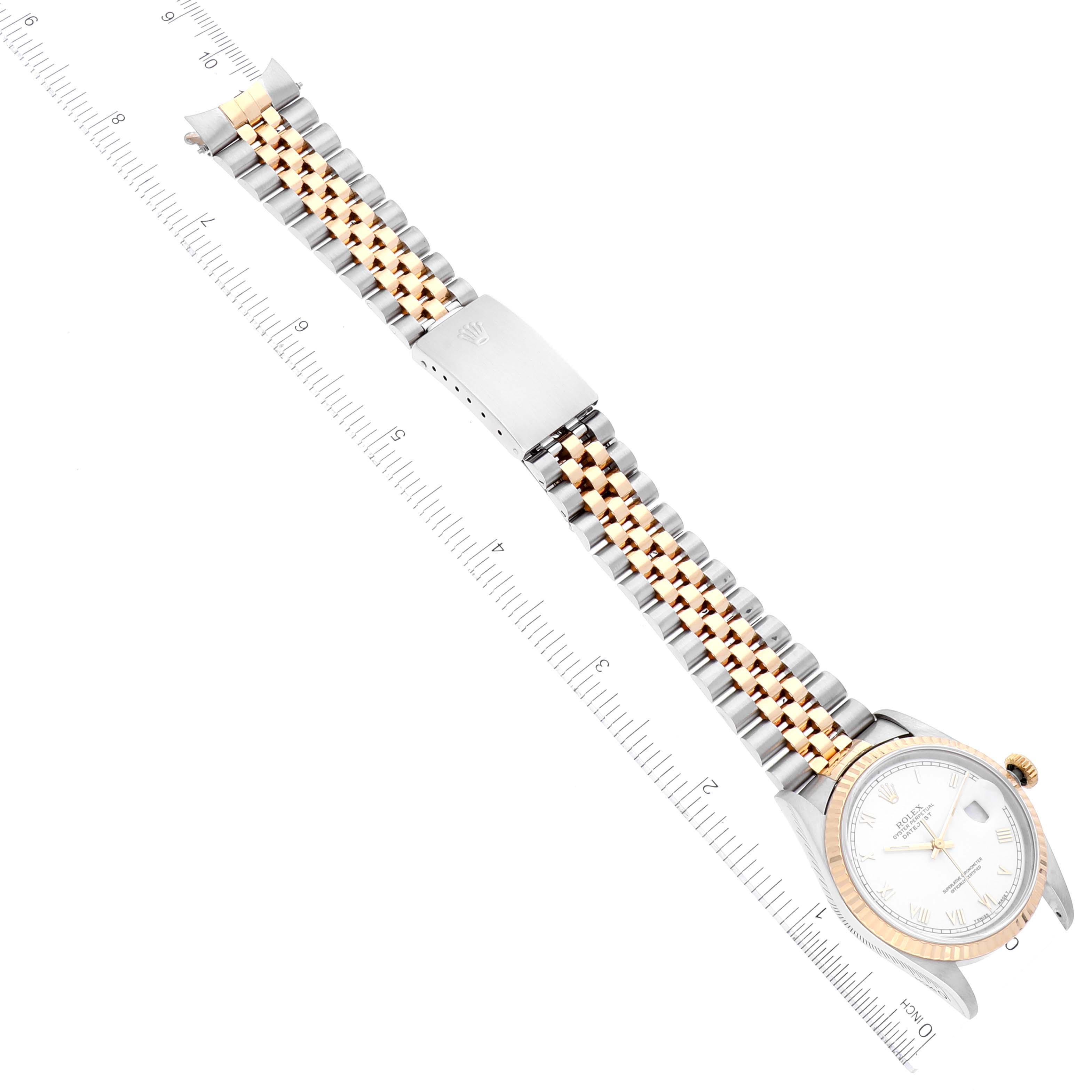 The image shows a Rolex Datejust 16233 Men's Steel and Gold (two tone) White Dial 16233 Men's Steel and Gold (two tone) White Dial model watch from a top-down angle, highlighting the two-tone bracelet and face.