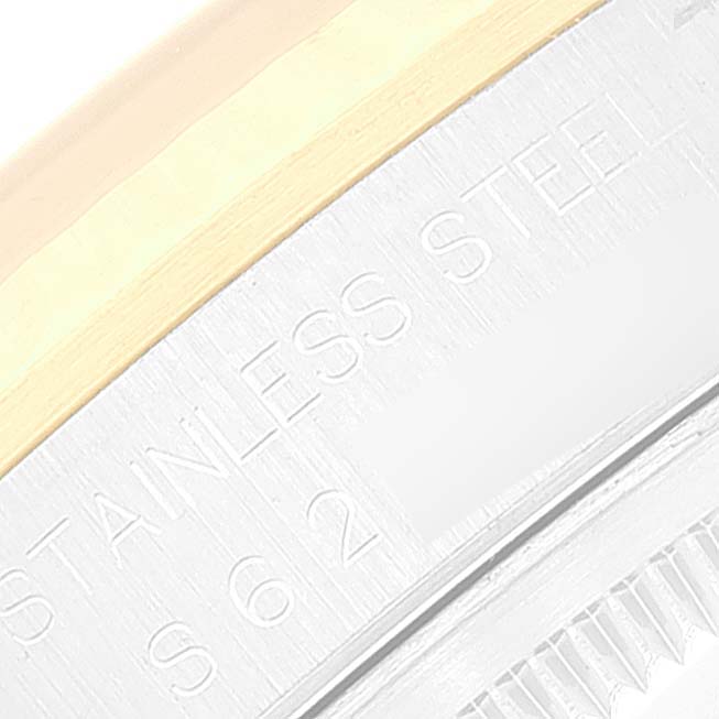This close-up image of the Rolex Datejust 16233 Men's Steel and Gold (two tone) White Dial 16233 Men's Steel and Gold (two tone) White Dial shows part of the bezel and the engraved text on the watch case.