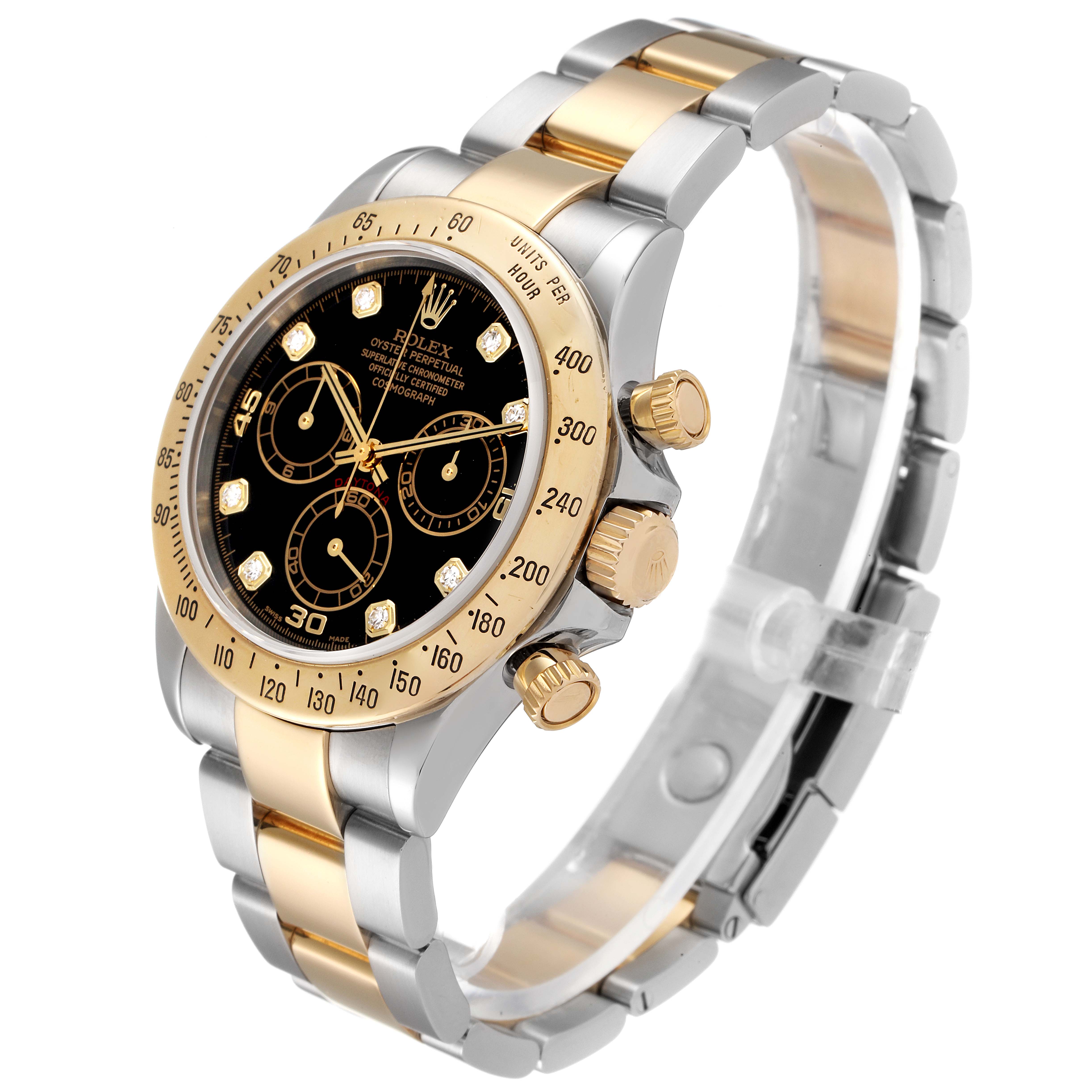 The image shows a Rolex Daytona 116523 Men
s Steel and Gold (two tone) Black Dial 116523 Men
s Steel and Gold (two tone) Black Dial watch at a three-quarter angle, highlighting its gold and stainless steel bracelet and black dial with subdials.