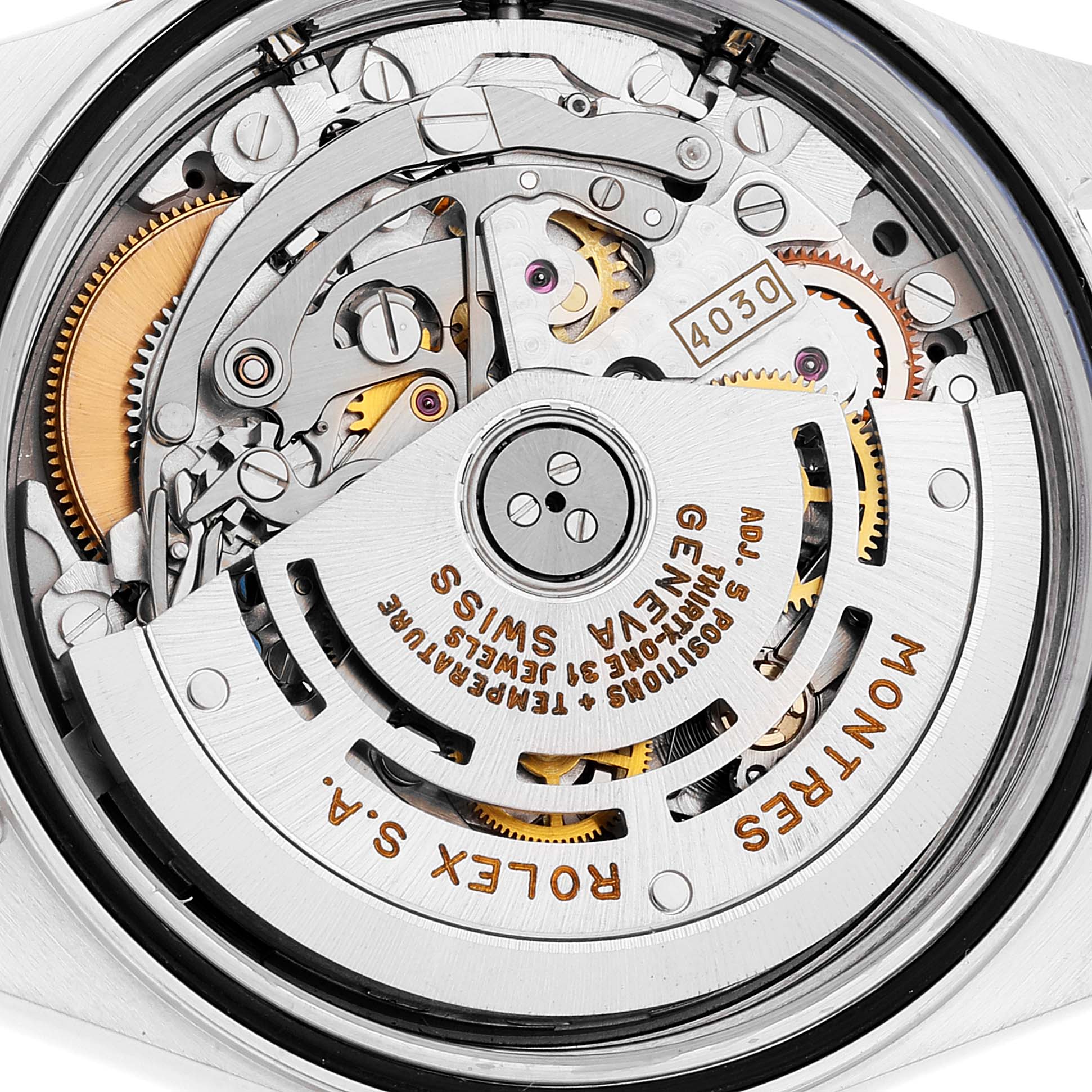 This image shows the intricate internal mechanism of a Rolex Daytona 16523 Men's Steel and Gold (two tone) Black Dial 16523 Men's Steel and Gold (two tone) Black Dial watch from a rear angle, highlighting the rotor and gears.
