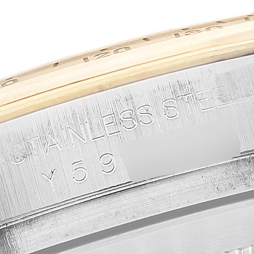 This close-up image of the Rolex Daytona 116523 Men's Steel and Gold (two tone) Mother of Pearl Dial 116523 Men's Steel and Gold (two tone) Mother of Pearl Dial watch shows a portion of the stainless steel case detailing.