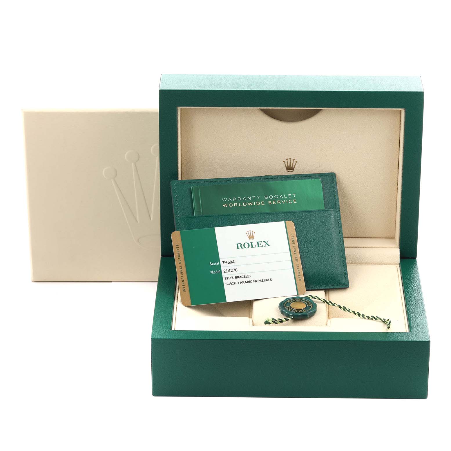 The image shows a Rolex Explorer 214270 Men
s Stainless Steel Black Dial 214270 Men
s Stainless Steel Black Dial box with a warranty booklet, cardholder, and seal from a top angle.